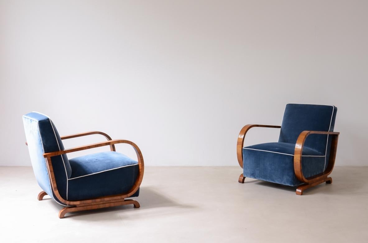 COD-2697
Pair of armchairs with curved wooden armrests and padded velvet seat.

Hungarian manufacture, 1930s-40s.

80 x 65 h 75 cm seat 40 cm