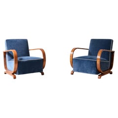 Pair of Decò armchairs with curved wooden armrests