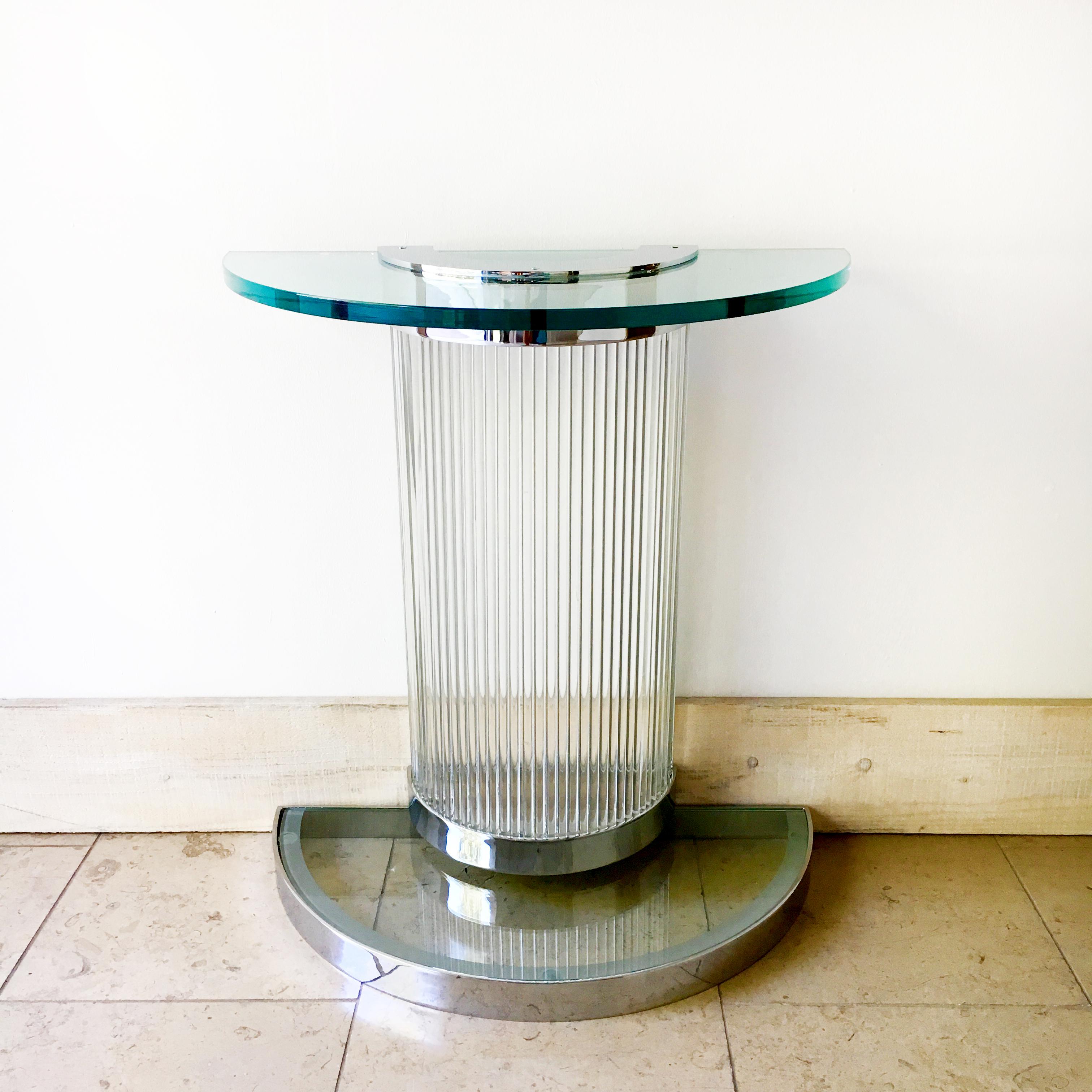 A pair of Art Deco influenced chromed steel and glass rod demilune console tables in the manner of Donald Deskey, 1960s
Could be wired to be lit internally for additional drama!
Require wall mounting for stability
Sold as seen with original 20mm