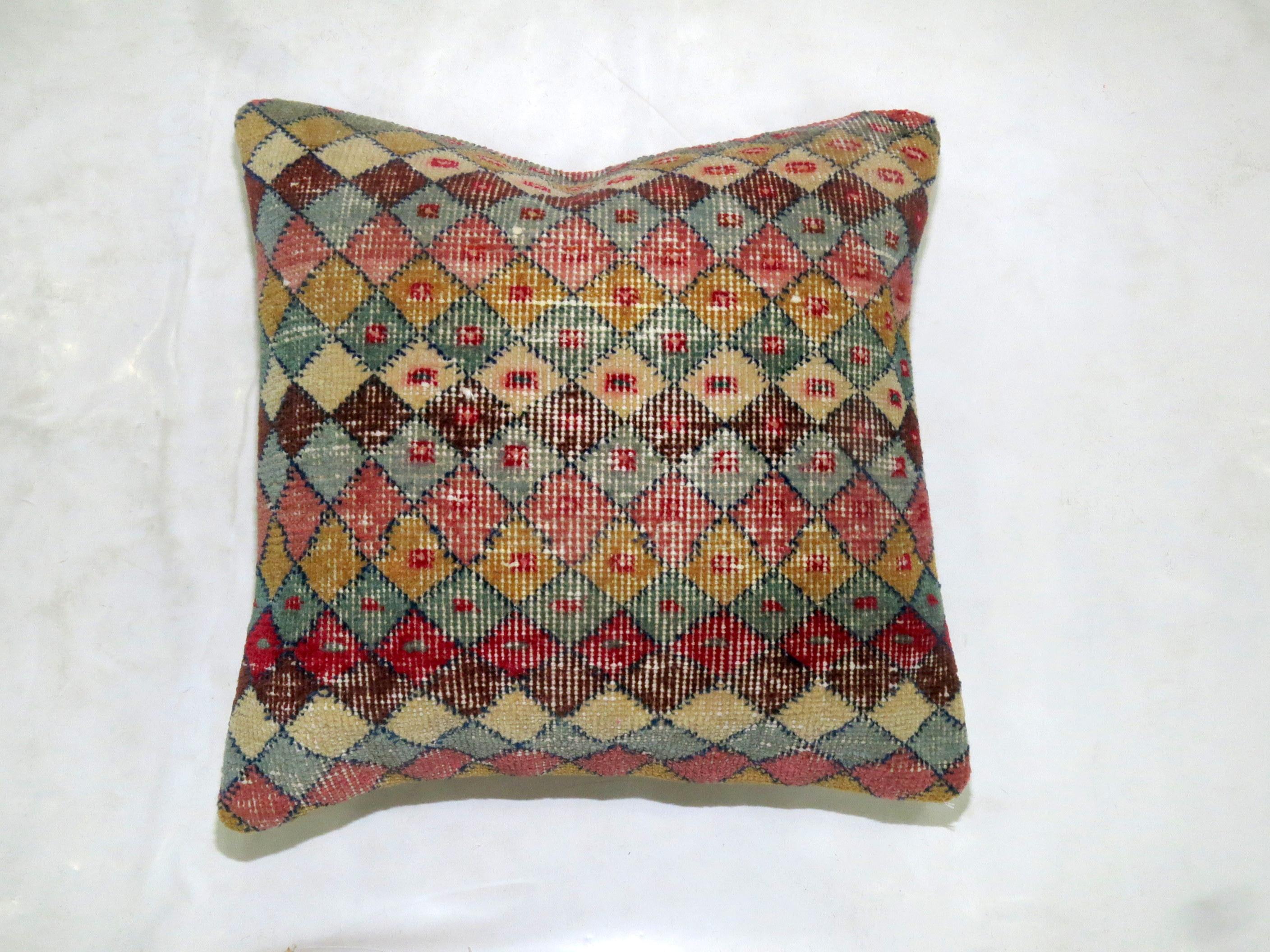 Set of pillows made from a midcentury Turkish deco rug. 

Both measure 18'' x 18''.