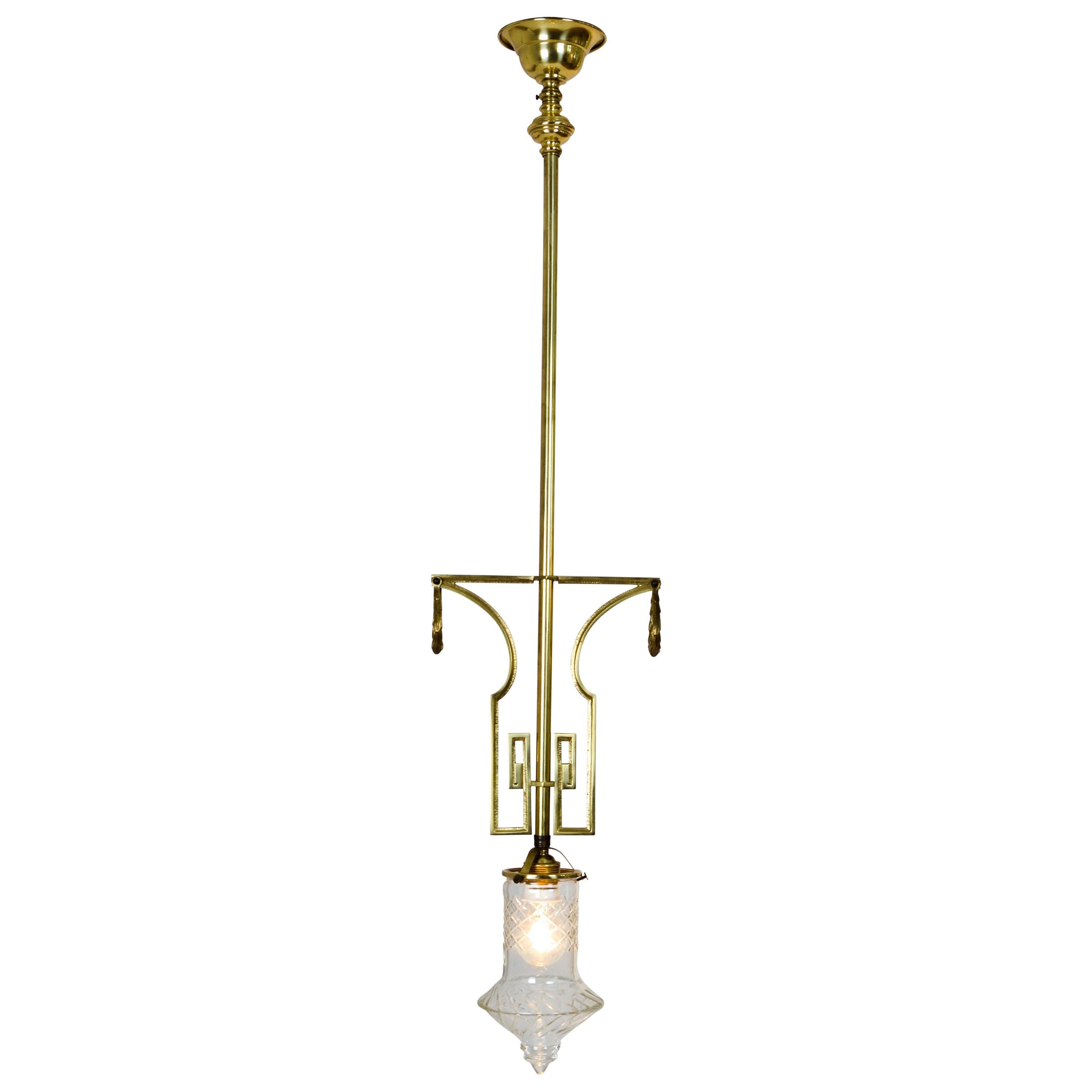 Pair of Decorated Art Deco Cast Brass Pendant Lamps with Cut Crystal Shade For Sale
