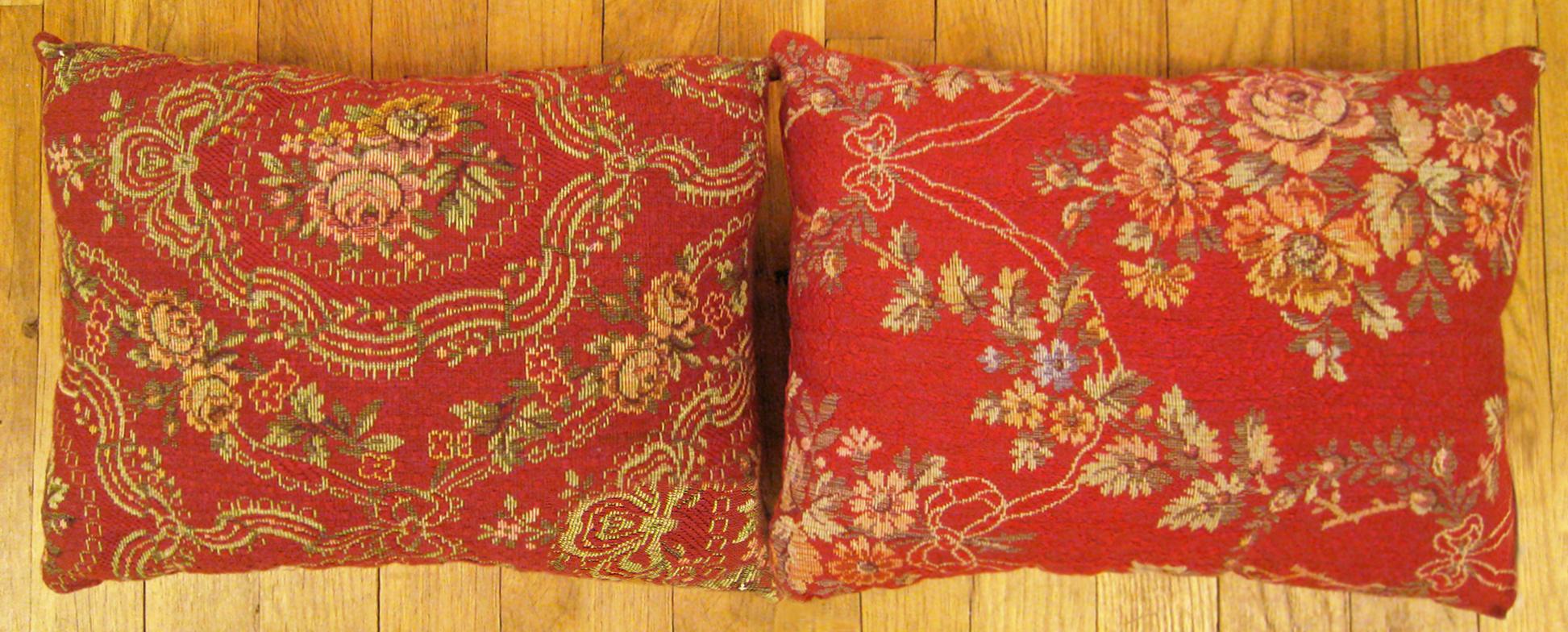 A Pair of Antique Jacquard Tapestry Pillows ; size 1'0” x 1'3” Each.

An antique decorative pillows with floral elements allover a red central field, size 1'0