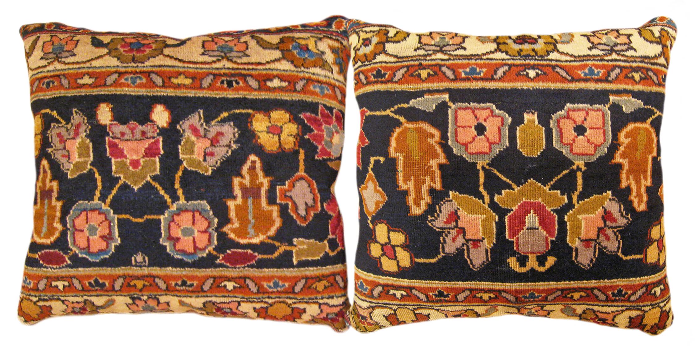 A pair of antique indian agra rug pillows ; size 1'5” x 1'5”

An antique decorative pillows with floral elements allover a blue central field, size  1'5” x 1'5”.  This lovely decorative pillow features an antique fabric of a Agra rug on front which