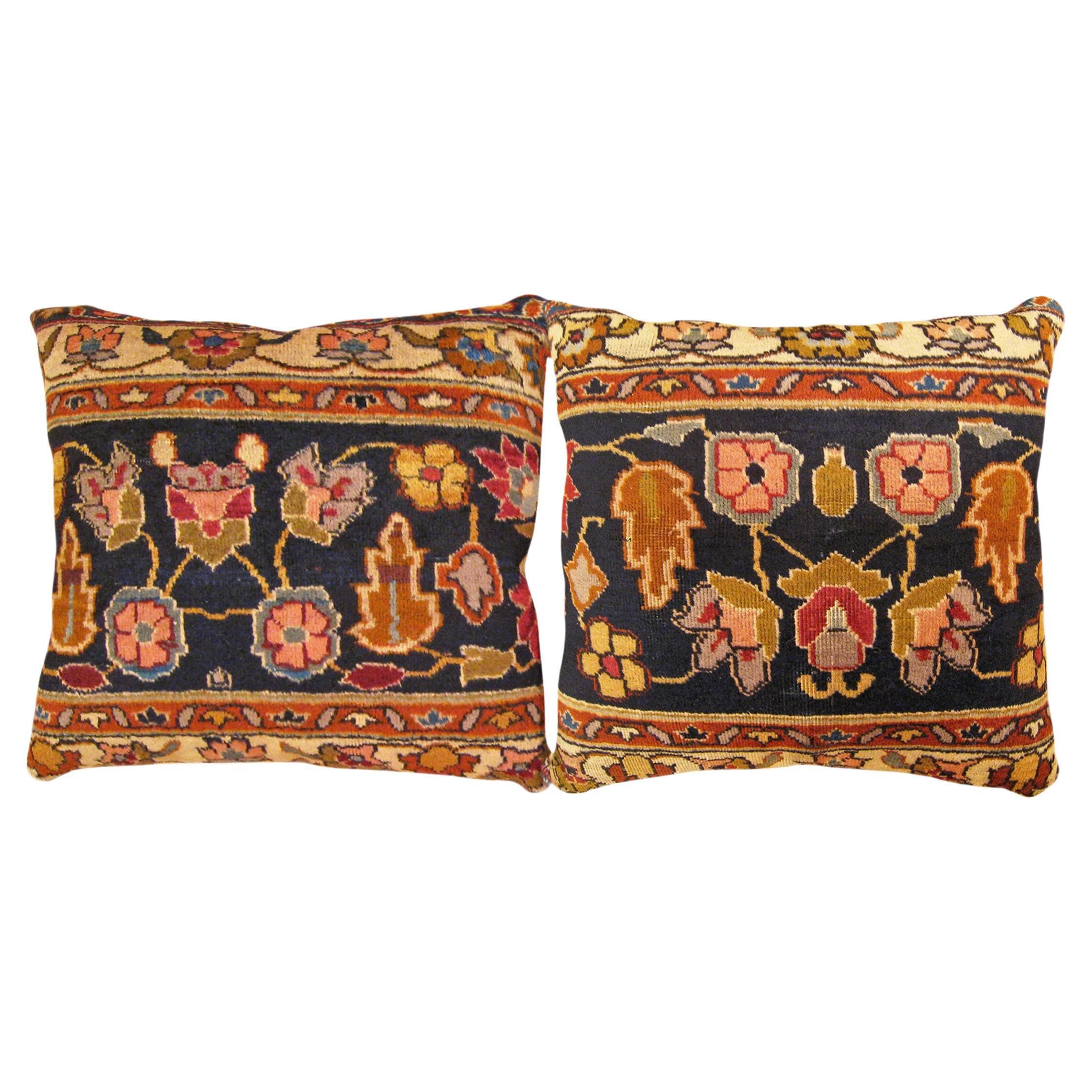 Pair of Decorative Antique Indian Agra Rug Pillows with Floral Elements For Sale