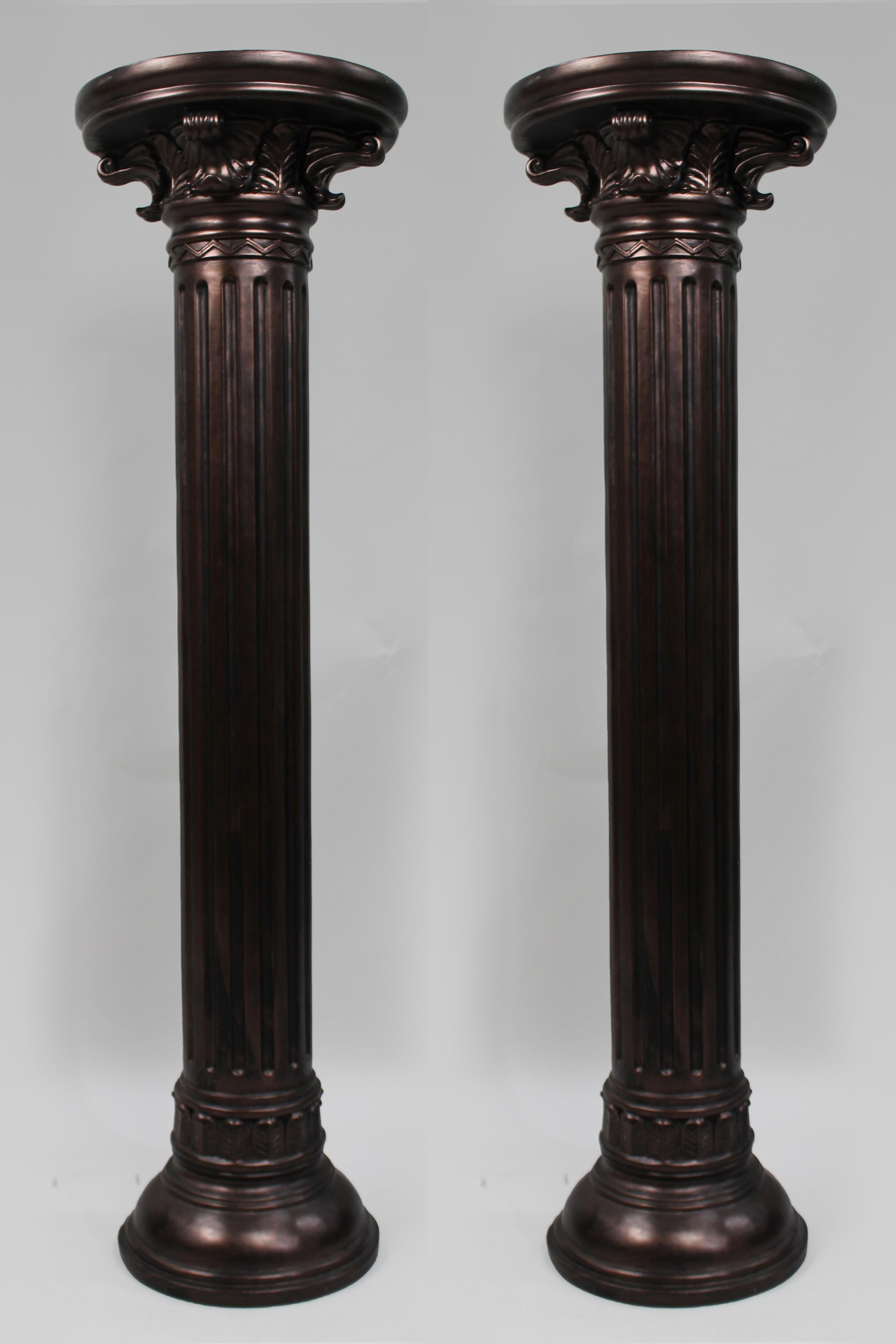 Pair of Decorative Antique Style Corinthian Pedestals, Late 20th Century

Pair of heavy decorative Corinthian column pedestals.
Composite construction with a bronzed effect finish, in antique style.

Late 20th century.

Measurements:

Height: 111.5