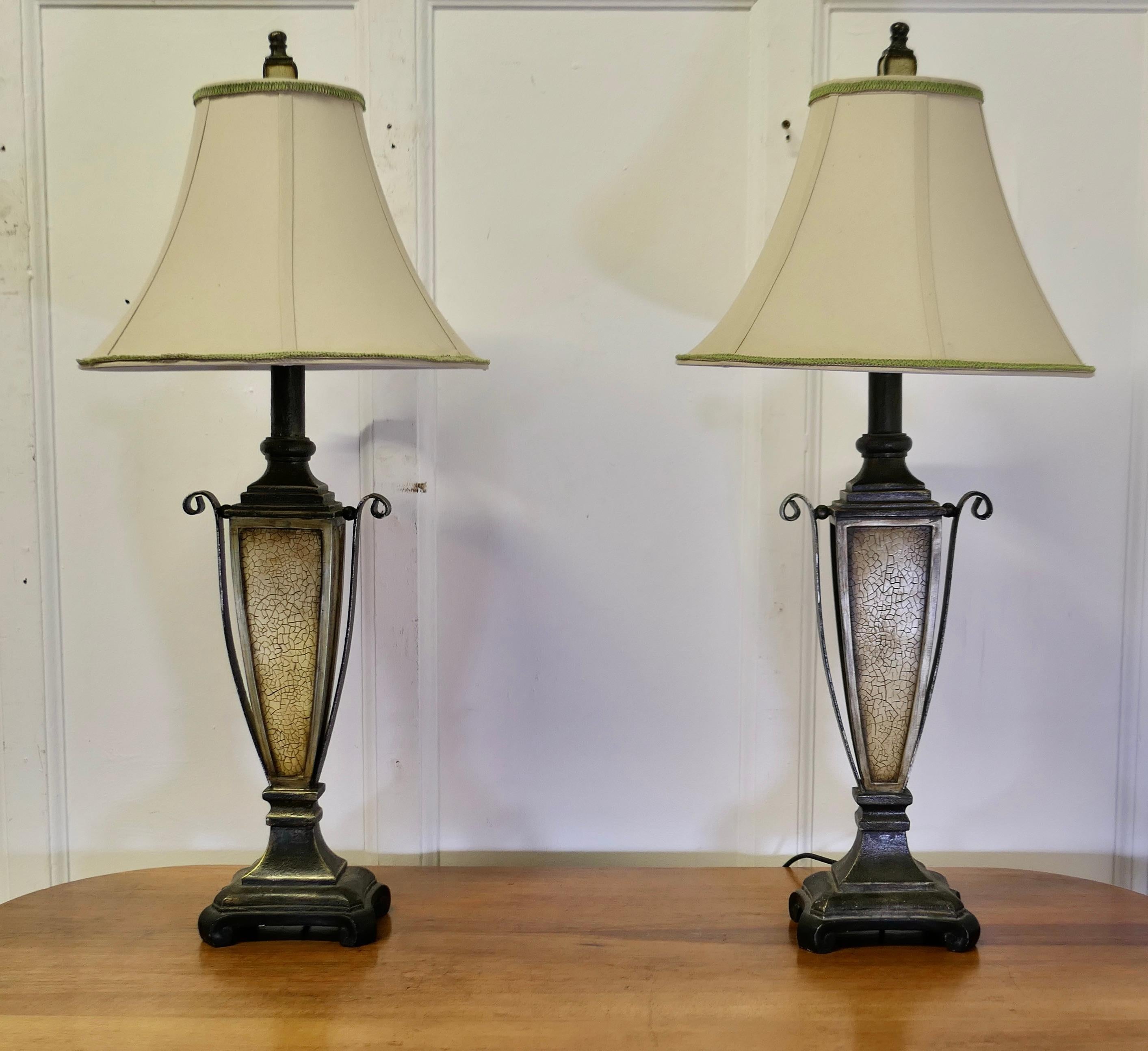 Pair of Decorative Art Deco Style Table Lamps 

This is an exciting pair of lamps, they are large and decorative and come with their own lampshades

The lamps are made in the shape of urns, they are in metal and a composition material, which is
