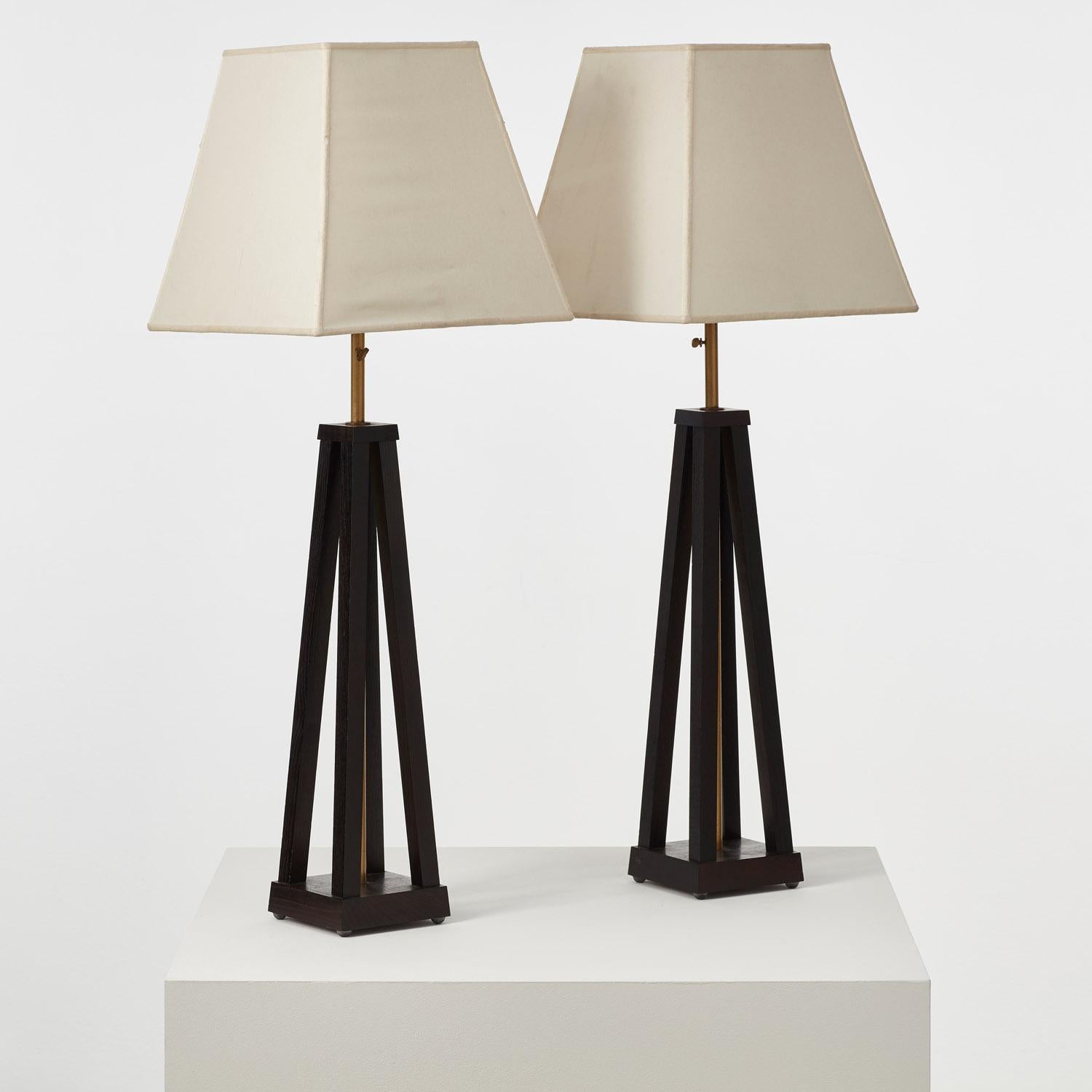 This pair of unusual blackened wood table lamps have a wonderful sense of poise and balance. The square shade mirrors the line of the flared base.

In good vintage condition, with some light marking to shades. Recently rewired and PAT tested to UK