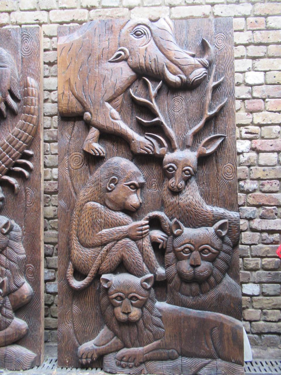 English Pair of Decorative Carved Teak Wood Panels with Monkeys and Other Wild Animals