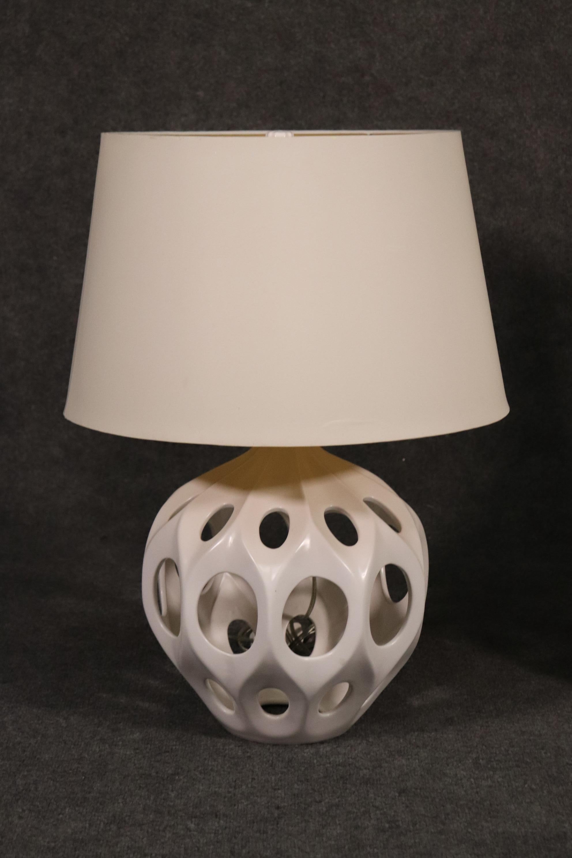 This is a beautiful pair of Mid-Century Modern style lamps. The lamps are absolutely beautifully designed and offer a 