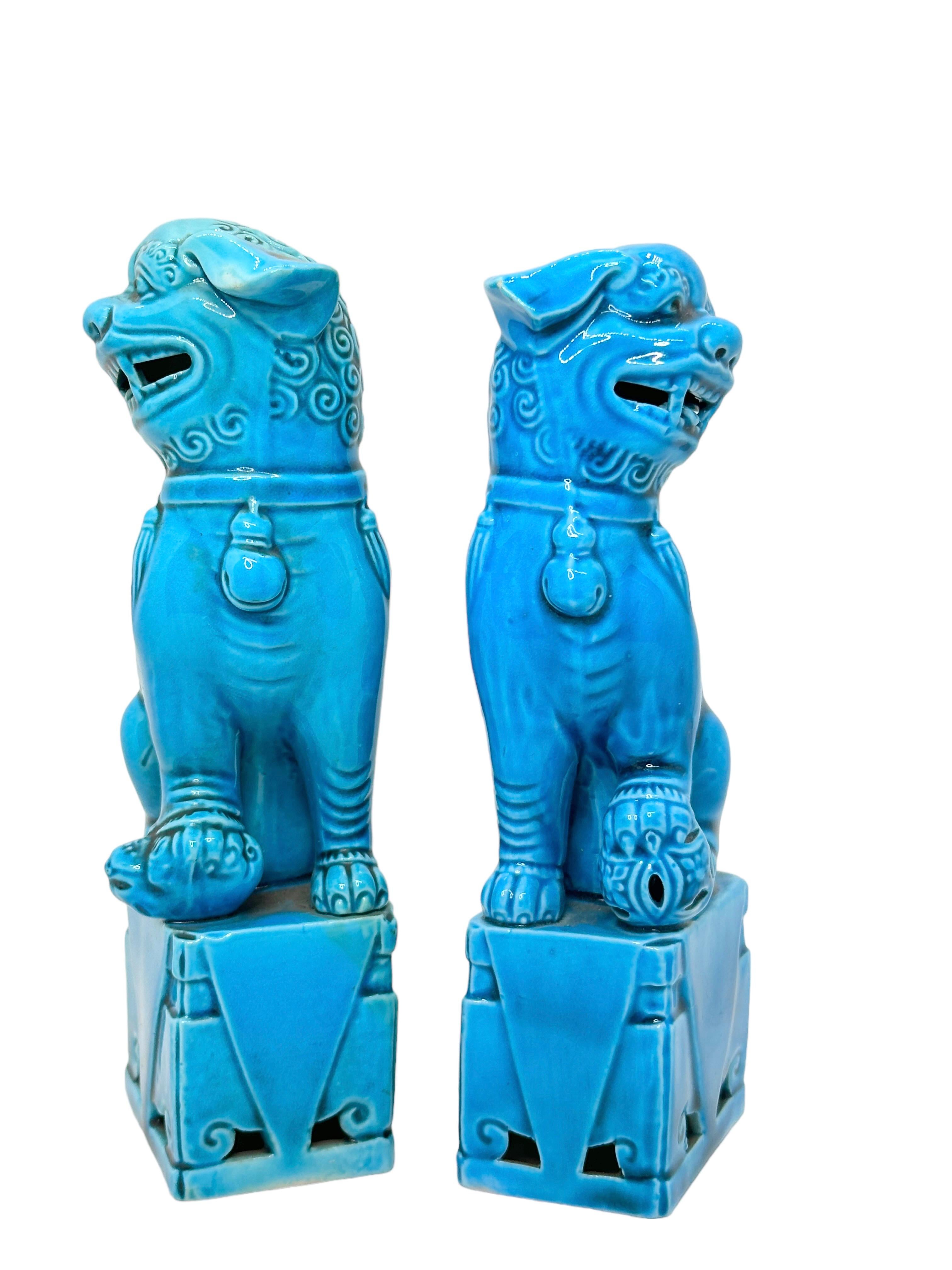 A very nice pair of vintage, medium size, turquoise blue, ceramic foo dogs, circa 1960s. Excellent condition and patina; makes a fun decor item in any room!