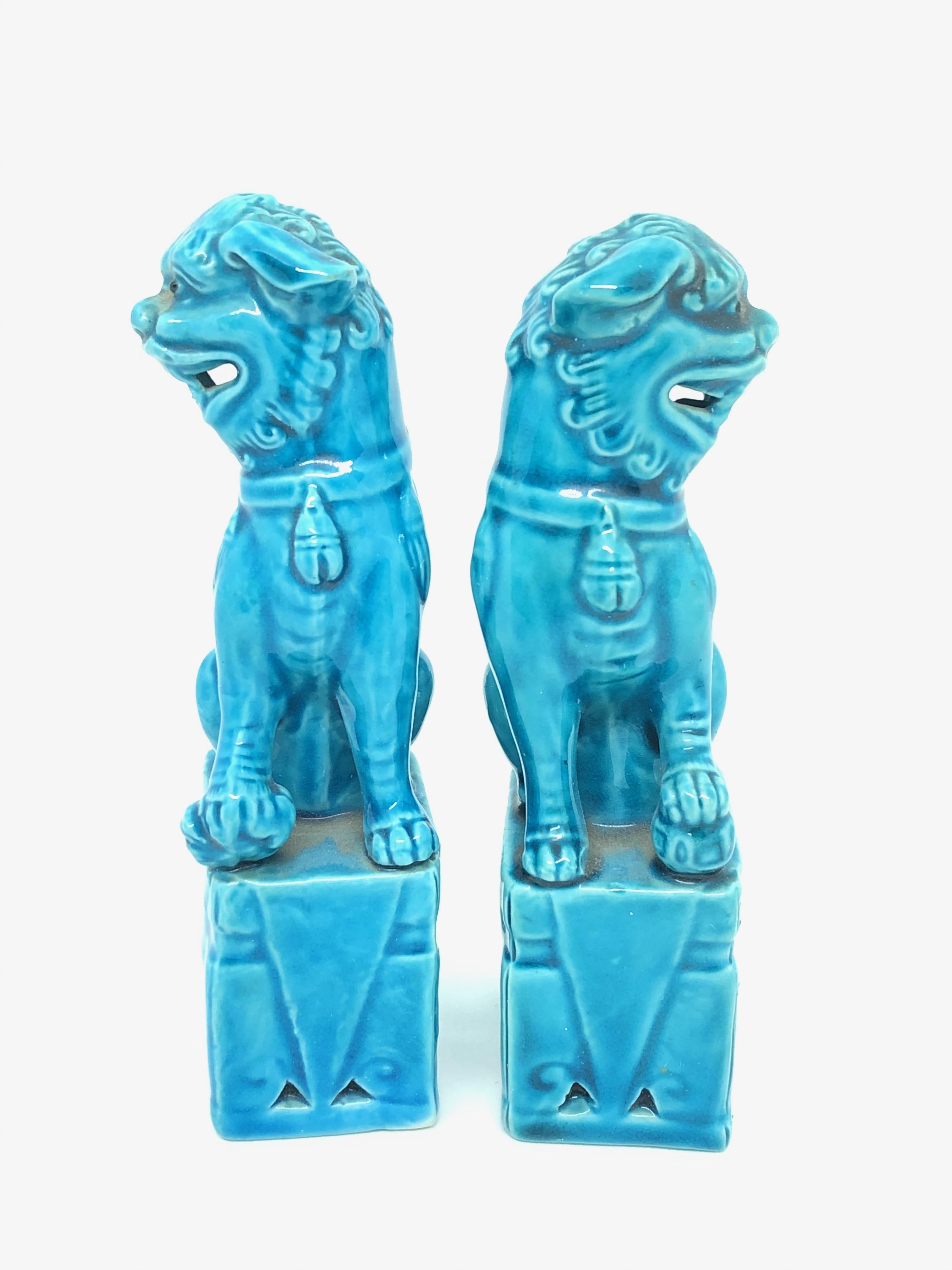 A very nice pair of vintage, mini, turquoise blue, ceramic foo dogs, circa 1960s. Excellent condition and patina; makes a fun decor item in any room!