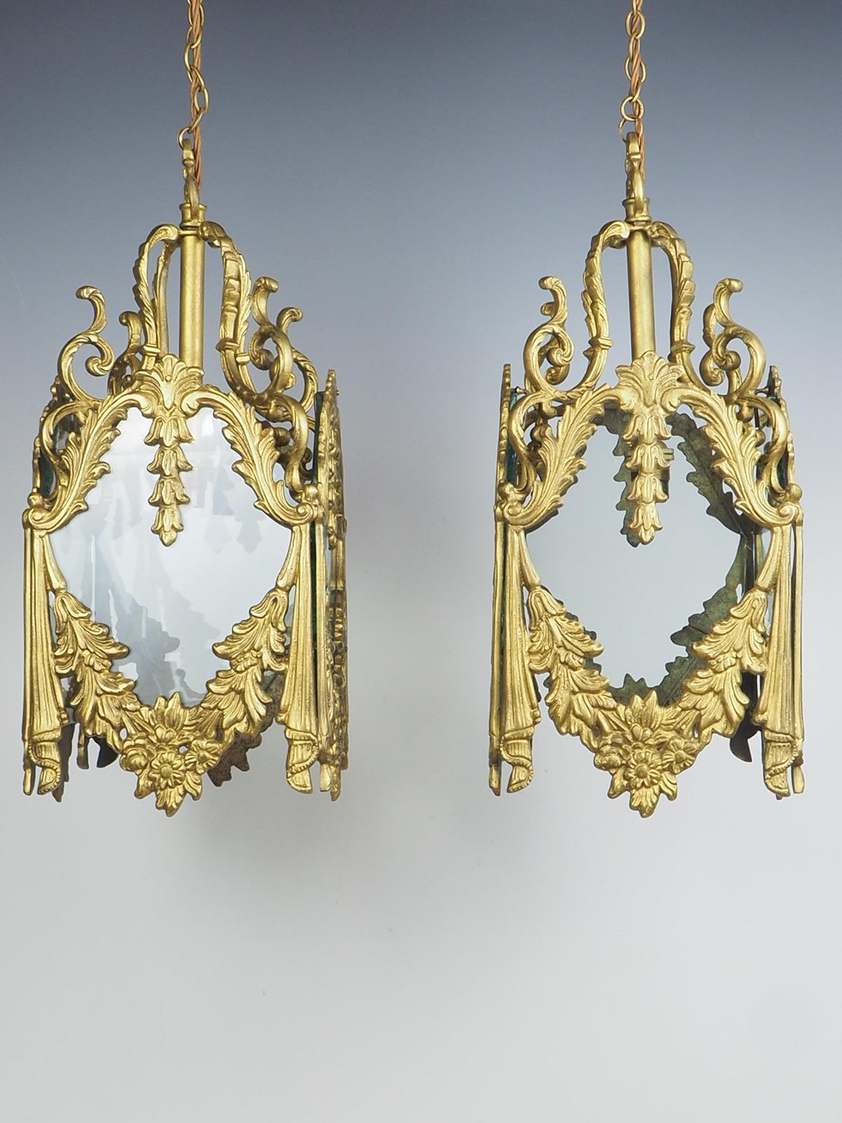 Oplulant Pair of Decorative French Rococo Gilt Brass Lanterns exude elegance and sophistication with their superb quality craftsmanship. Made from heavy gilt brass, these lanterns are built to last and make a lasting impression. Each lantern