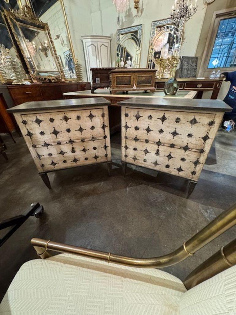 The Pair of Decorative German Neo-Classical Hand Painted Bedside Tables feature a black and white an interesting painted geometric design. Perfect for holding bedside essentials and adding a stylish touch to the room, these tables exhibit a unique