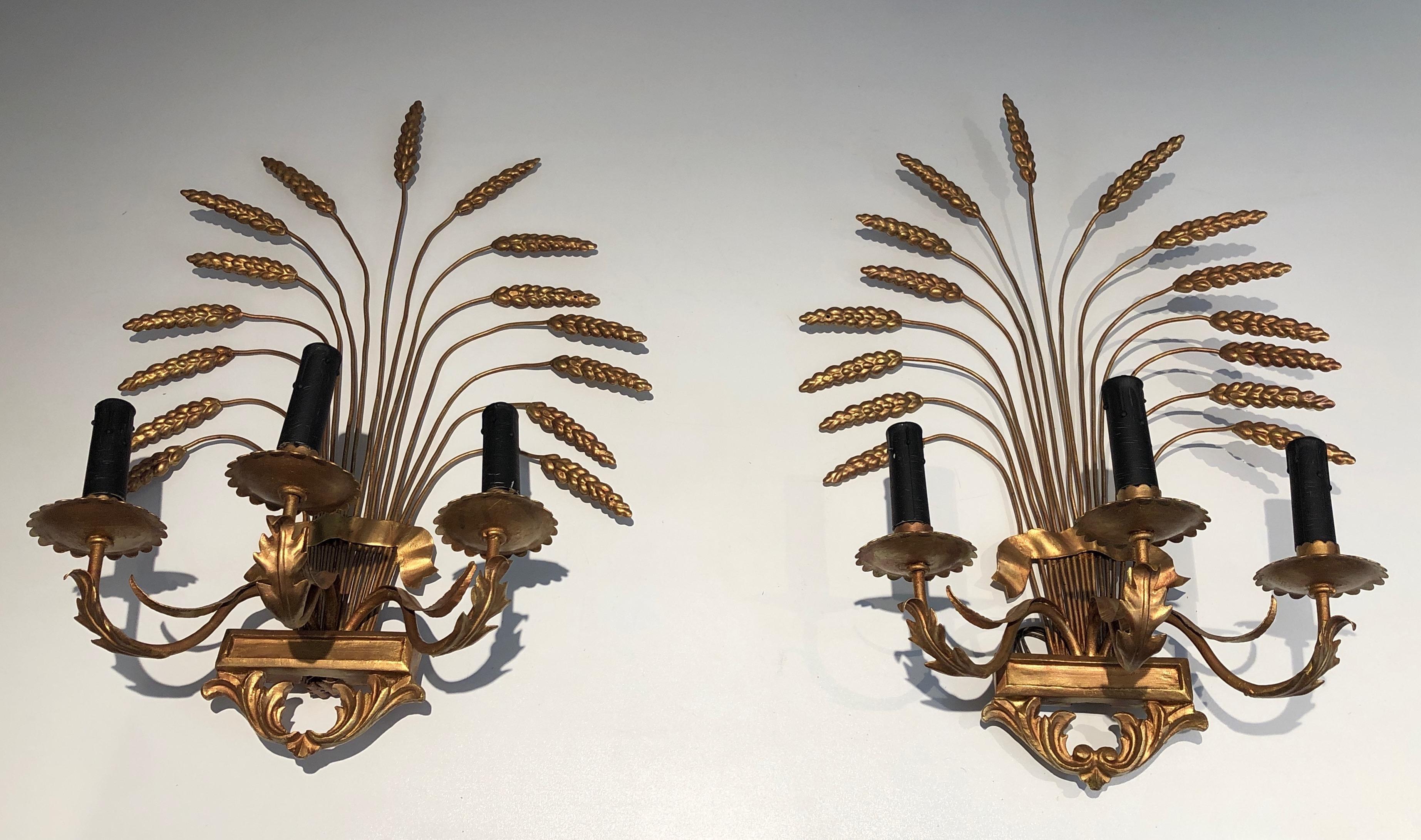 Pair of decorative gilded wheat wall sconces. French work in the style of Coco Channel. Circa 1970.