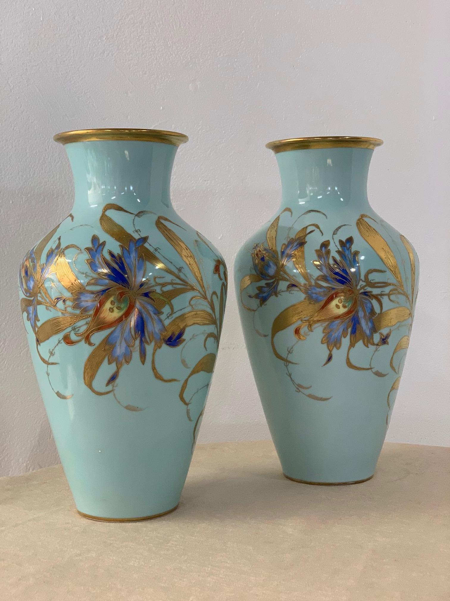 Beautiful pair of ceramic drilled vases with a floral hand painted pattern. Some of the leaves are gold gild with a really vibrant floral pattern. Made in West Germany.
Measures: 17 height body of vases (at its widest) 10