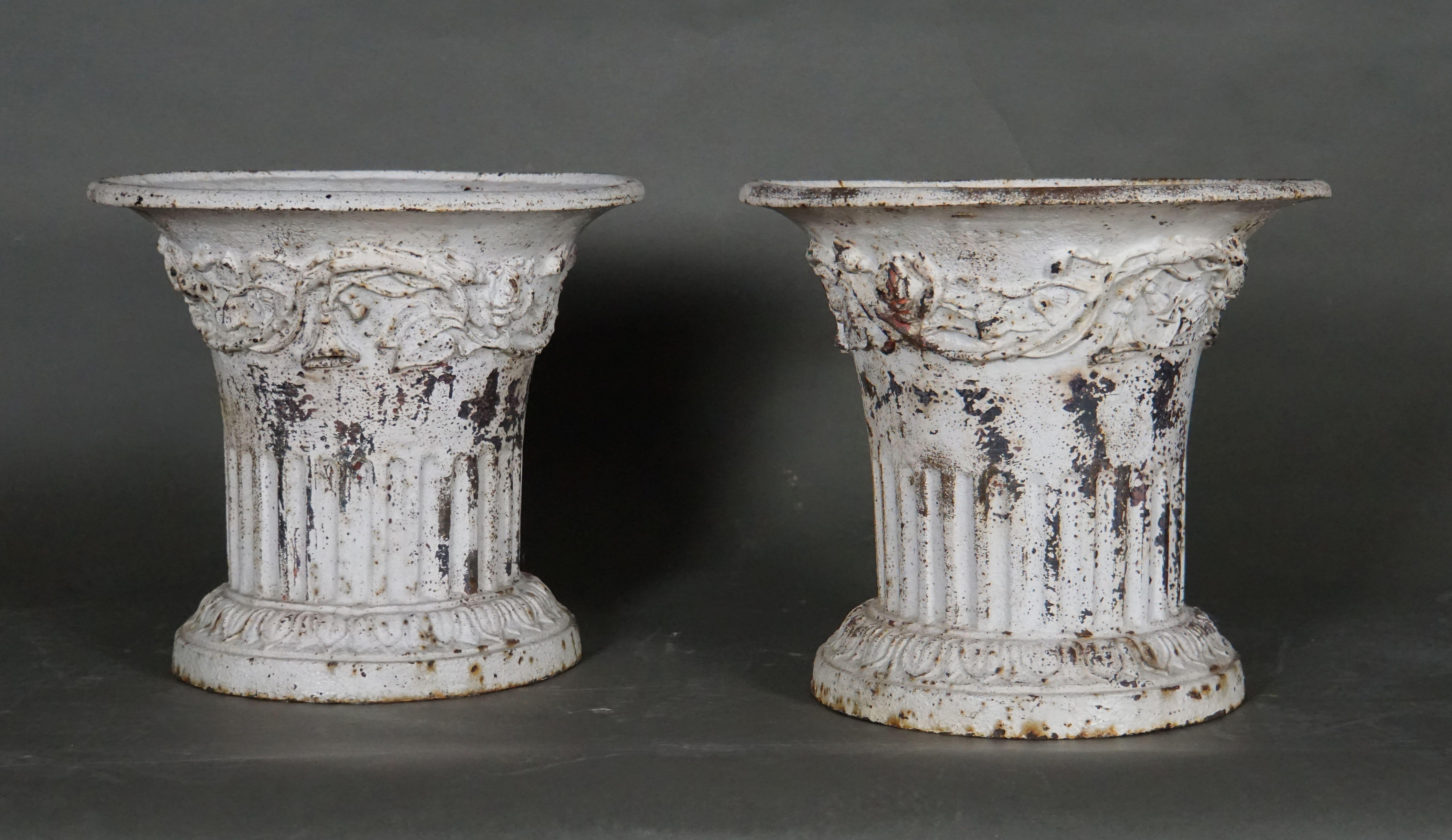Pair of iron cast Louis XVI vases with nice white patina, France, circa 1790. Beautiful indoor and outdoor decoration.
  
