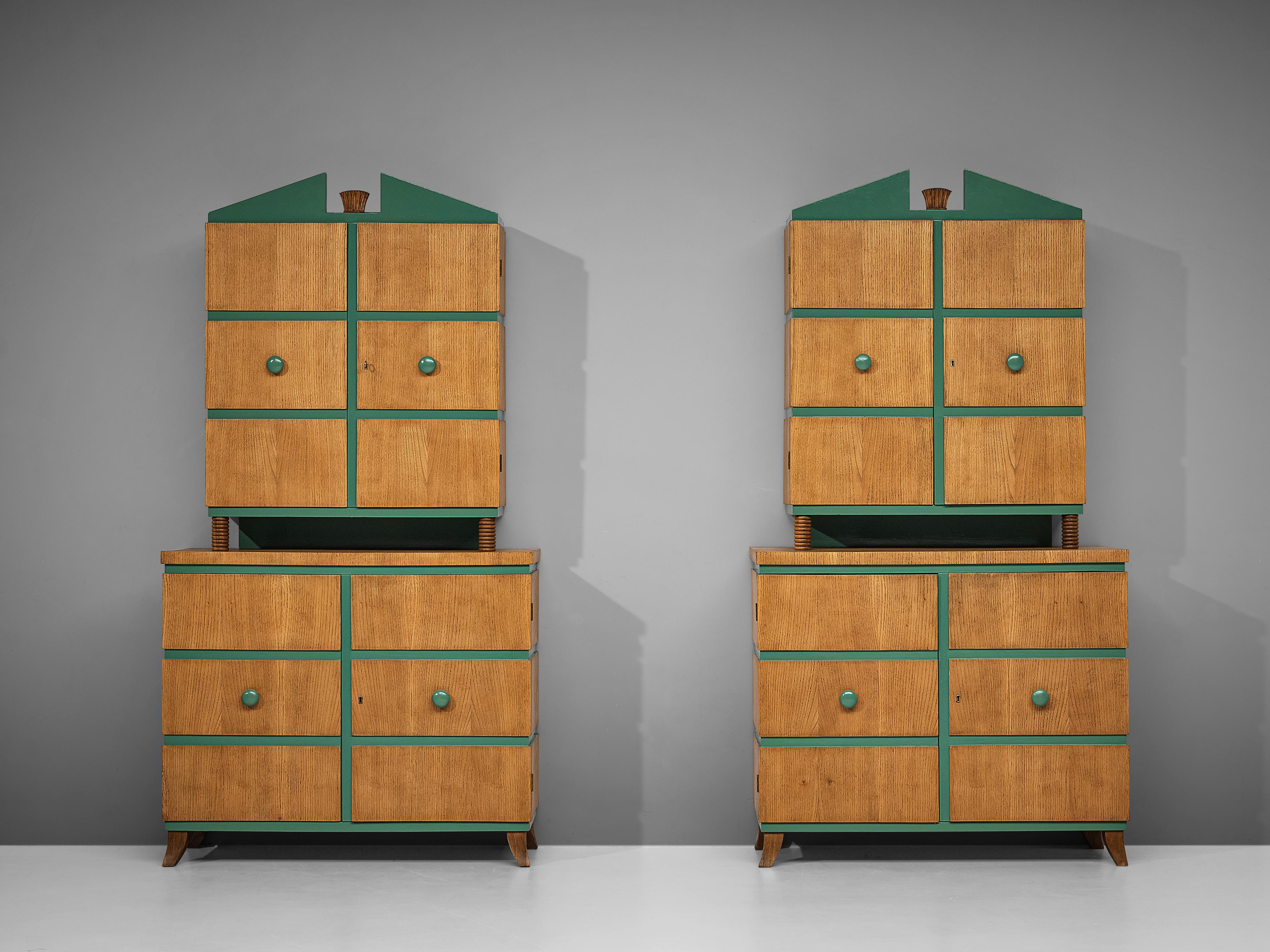 Pair of cabinets, oak, Italy, 1970s

These Art Deco inspired highboards have a very rare and unique look. The cabinets consist out of two layers that each form a different part. The upper piece has two doors with shelves and stunning decorative