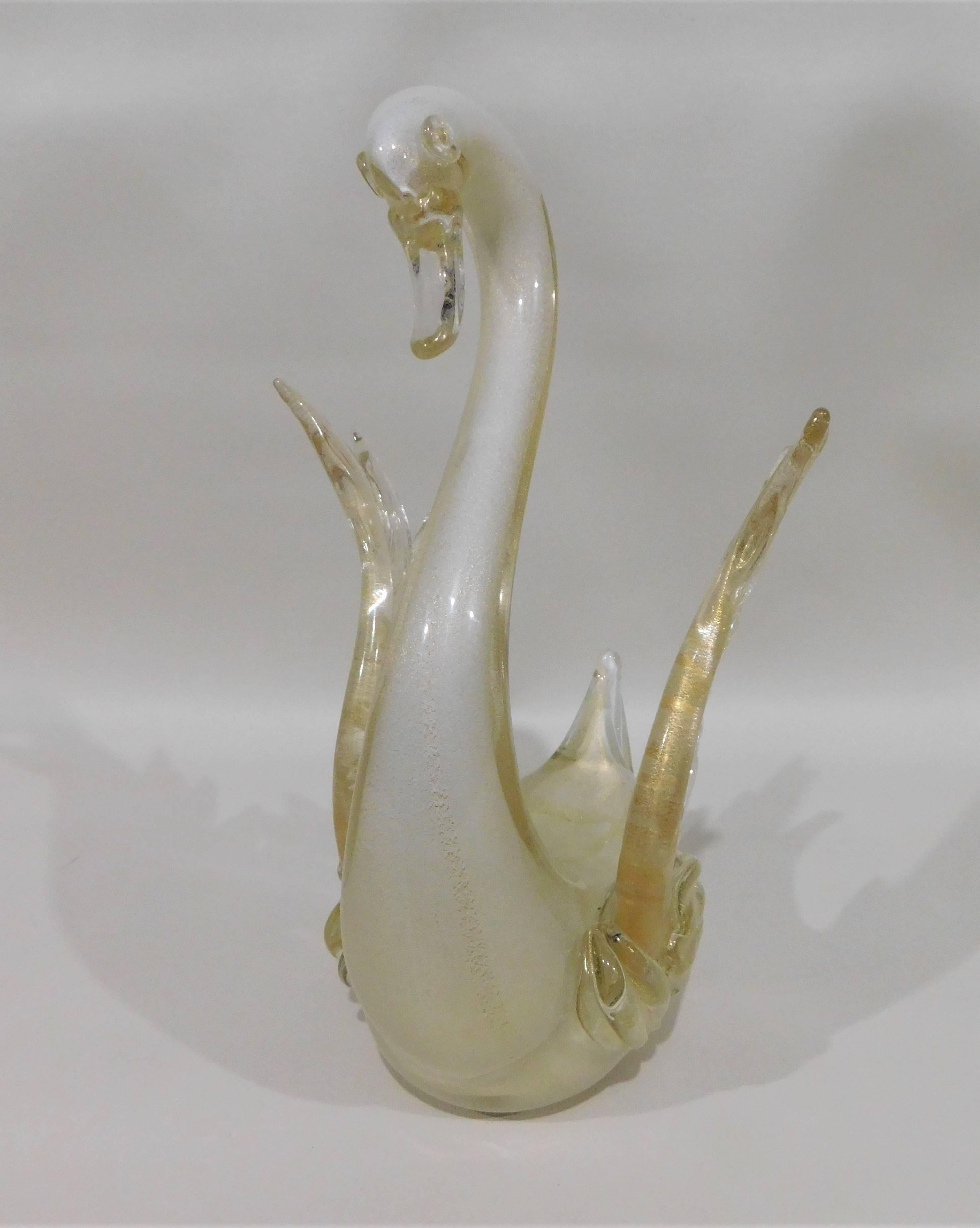 Pair of decorative Murano white swans with gold flecks attributed to Barovier and Toso.