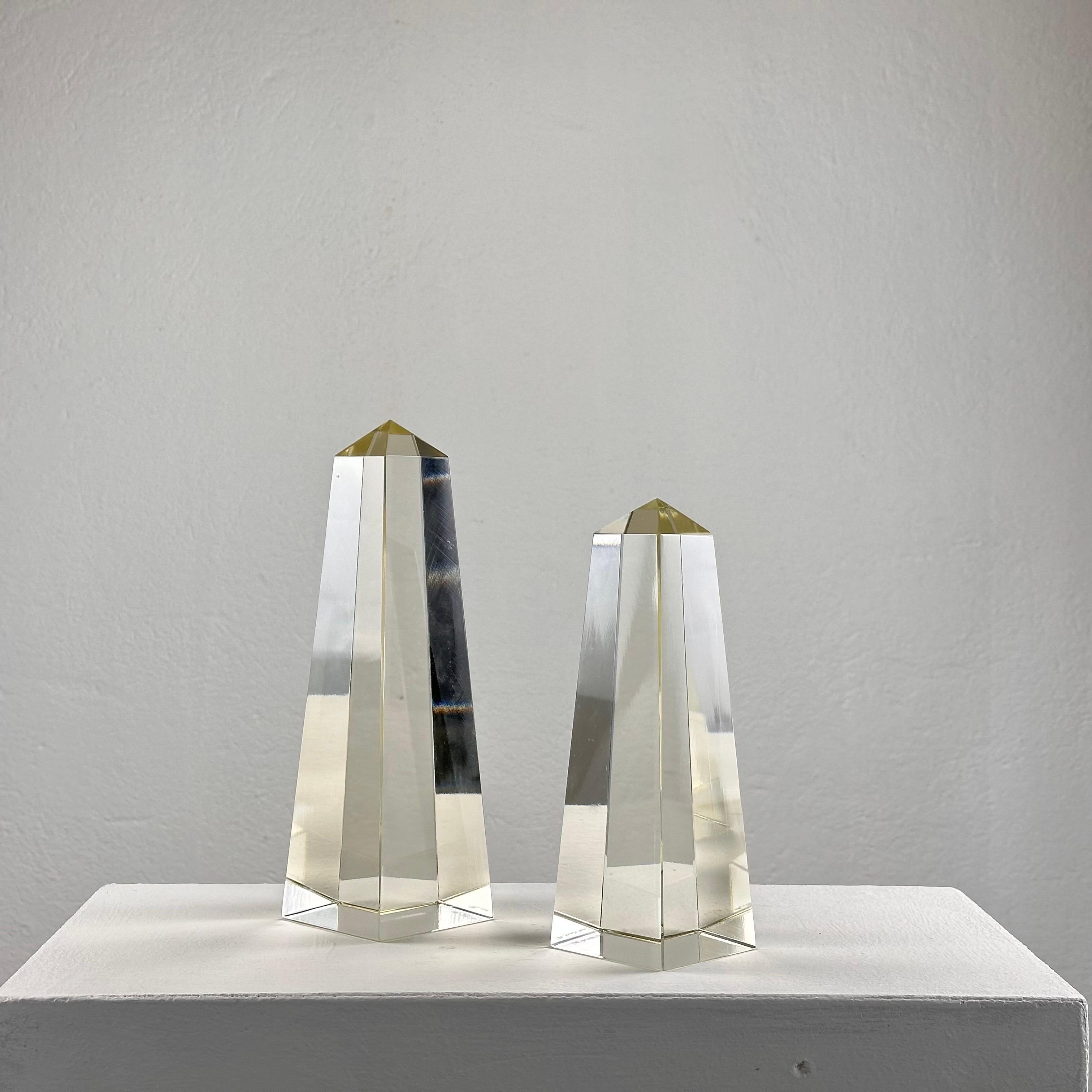 Add a touch of timeless elegance to your space with this pair of decorative obelisks crafted in pure glass, signed 