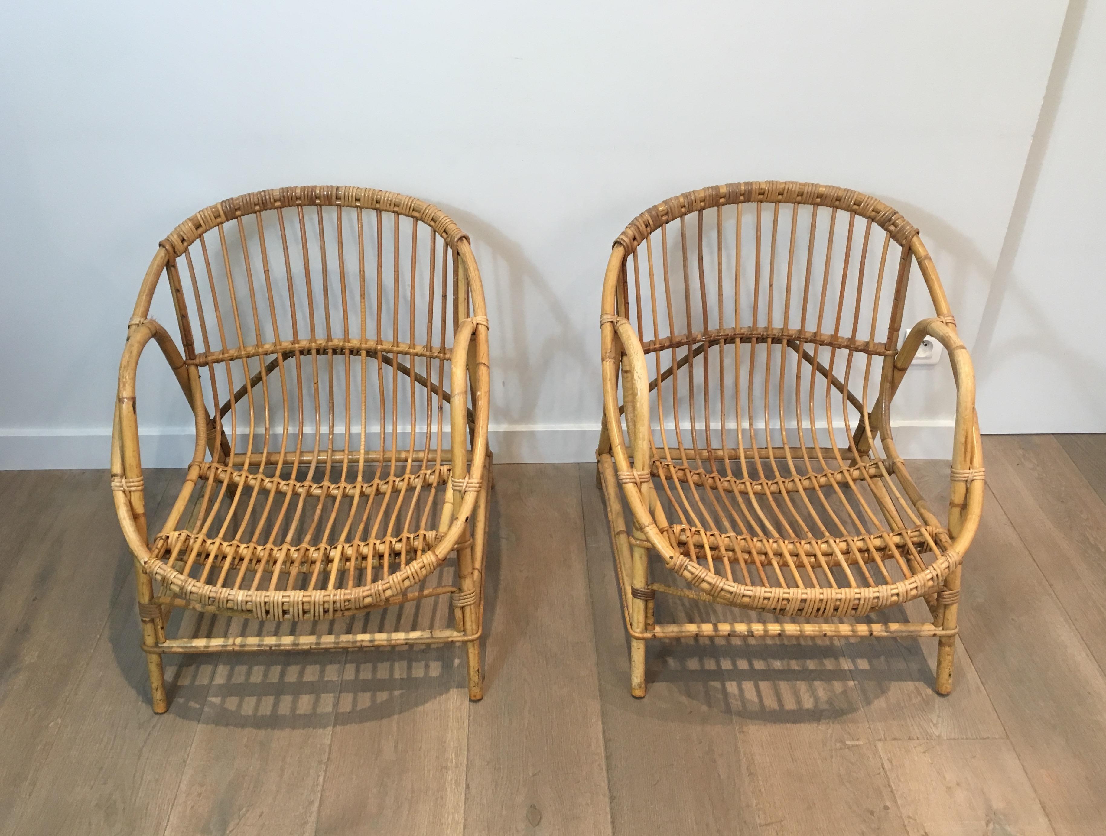 This pair of decorative armchairs are all made of rattan. This is a French work, circa 1970.
    