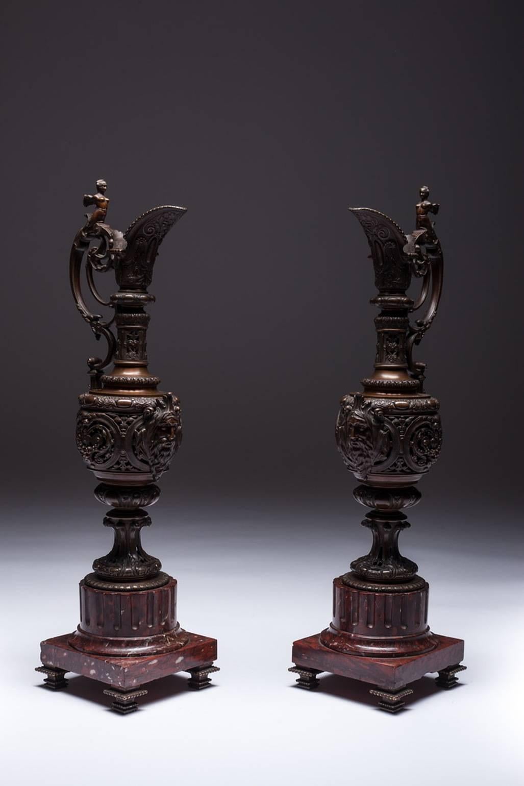 Pair of decorative Rocaille ewers in bronze with brown patina on red marble bases. Great condition, France, Napoleon III period. 
· Period: Of the period
Napoleon III
· Place of origin
France
· Date of manufacture
circa 1860
· Period
Late 19th