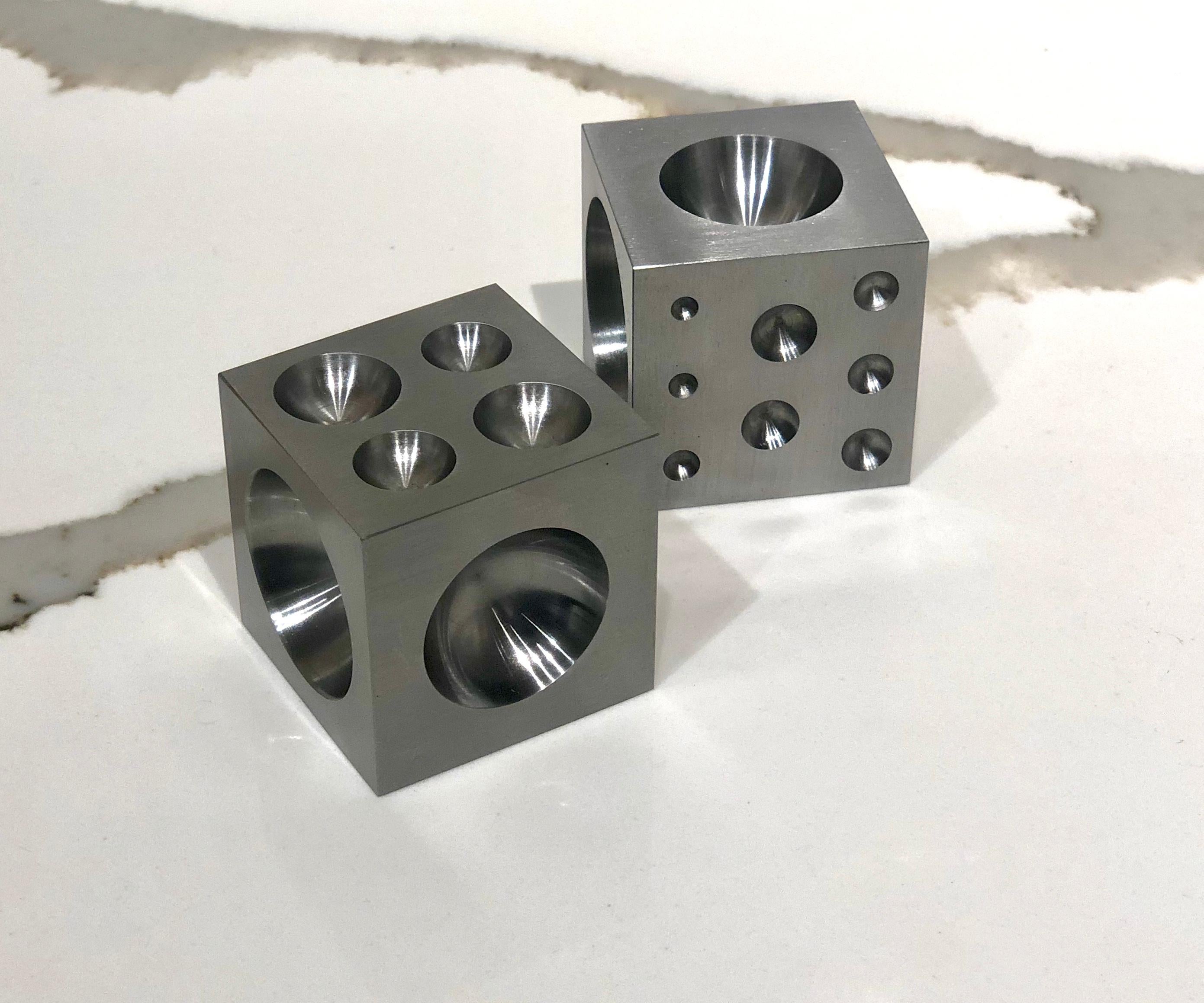 Unusual solid raw steel dice cubes decorative use, nice and heavy can be used like sculpture or paperweight. Can be put in many positions with different size of holes beautiful industrial design.