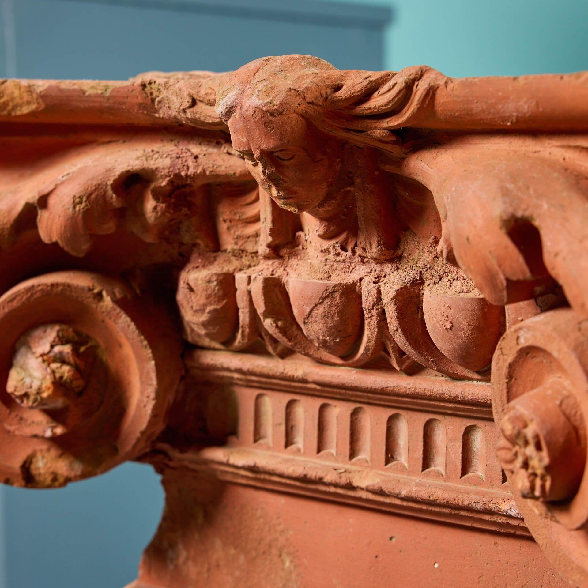 English Pair of Decorative Terracotta Ionic Capitals on Stands For Sale
