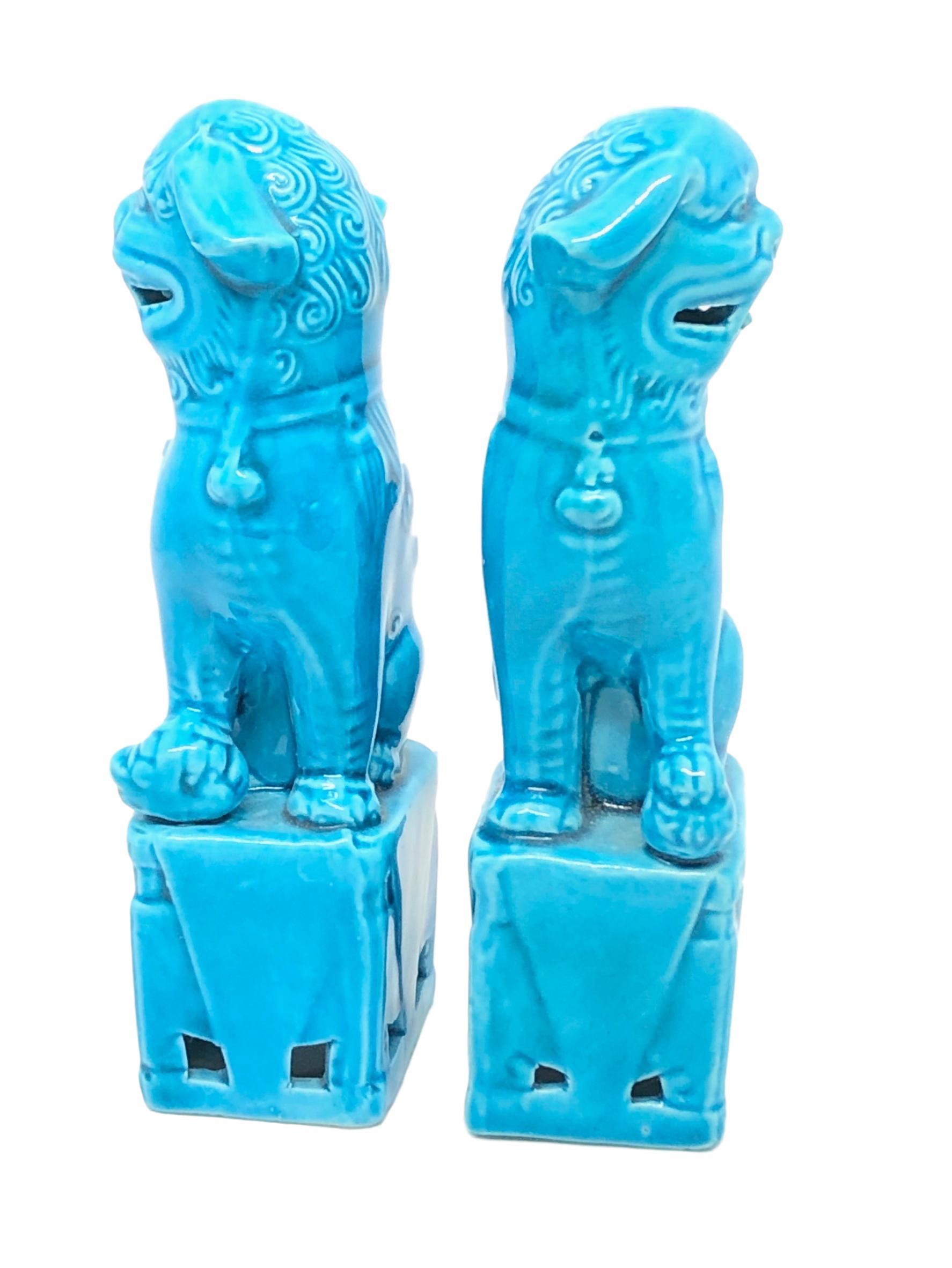 A very nice pair of vintage, mini, turquoise blue, ceramic foo dogs, circa 1980s. Excellent condition and patina; makes a fun decor item in any room!
.    