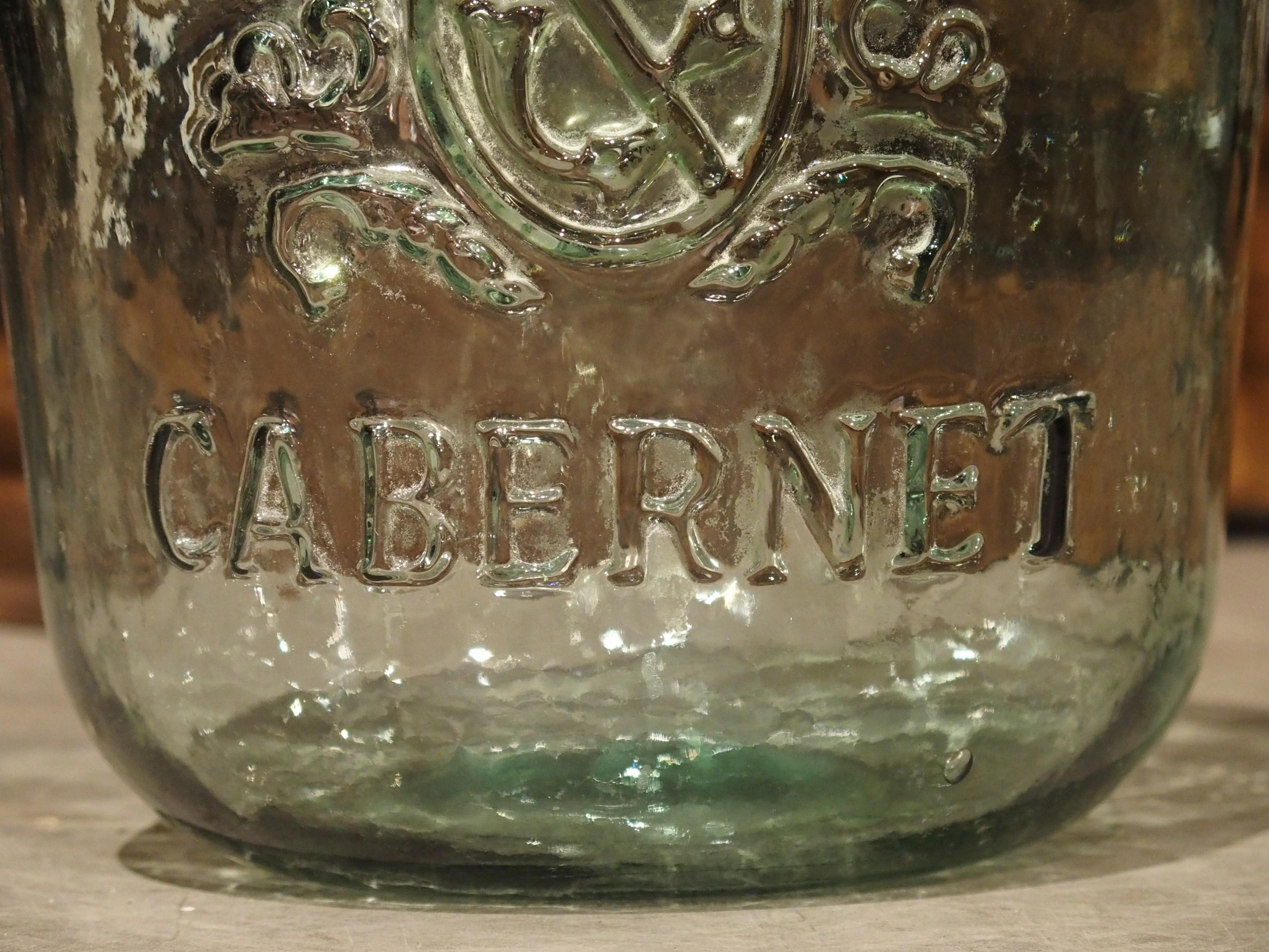 Pair of Decorative Vintage Coat of Arms Demijohn Bottles In Good Condition In Dallas, TX