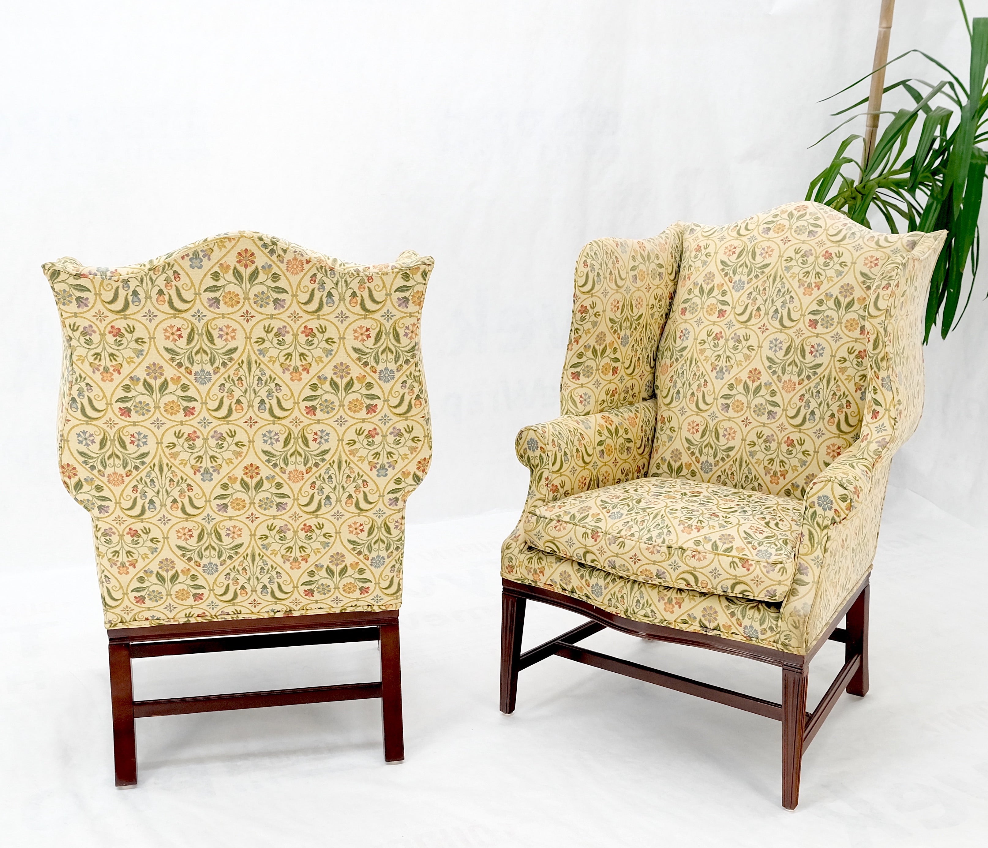 Pair of Deep Profile Antique Wing arm chairs mahogany legs Federal Style.