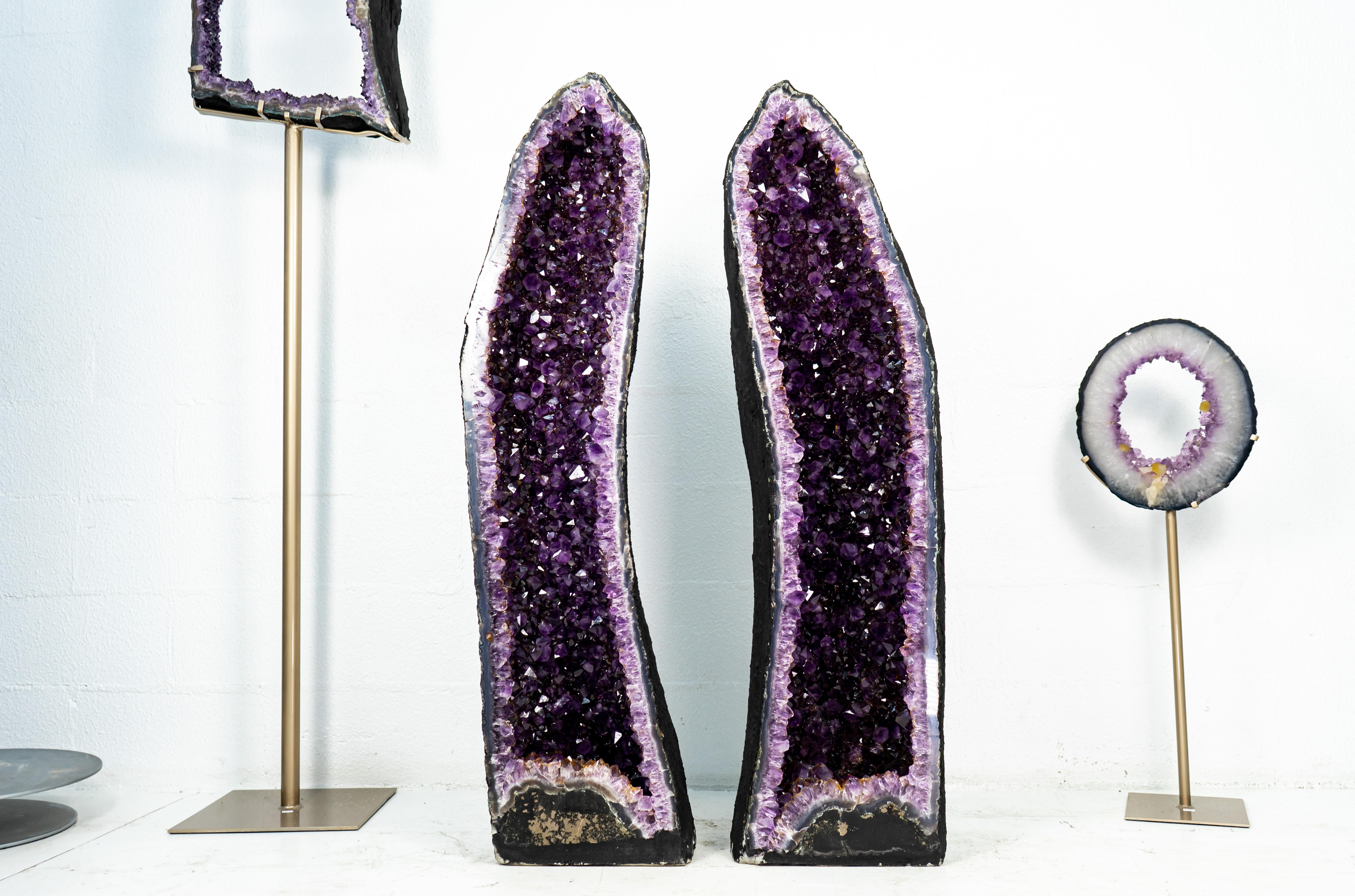 A pair of tall Amethyst Geodes with gorgeous aesthetics, these AAA Amethysts are ready to become a natural form of art to accentuate the space in your home or office decor or become a statement piece in your collection.

Bookmatching, both sides