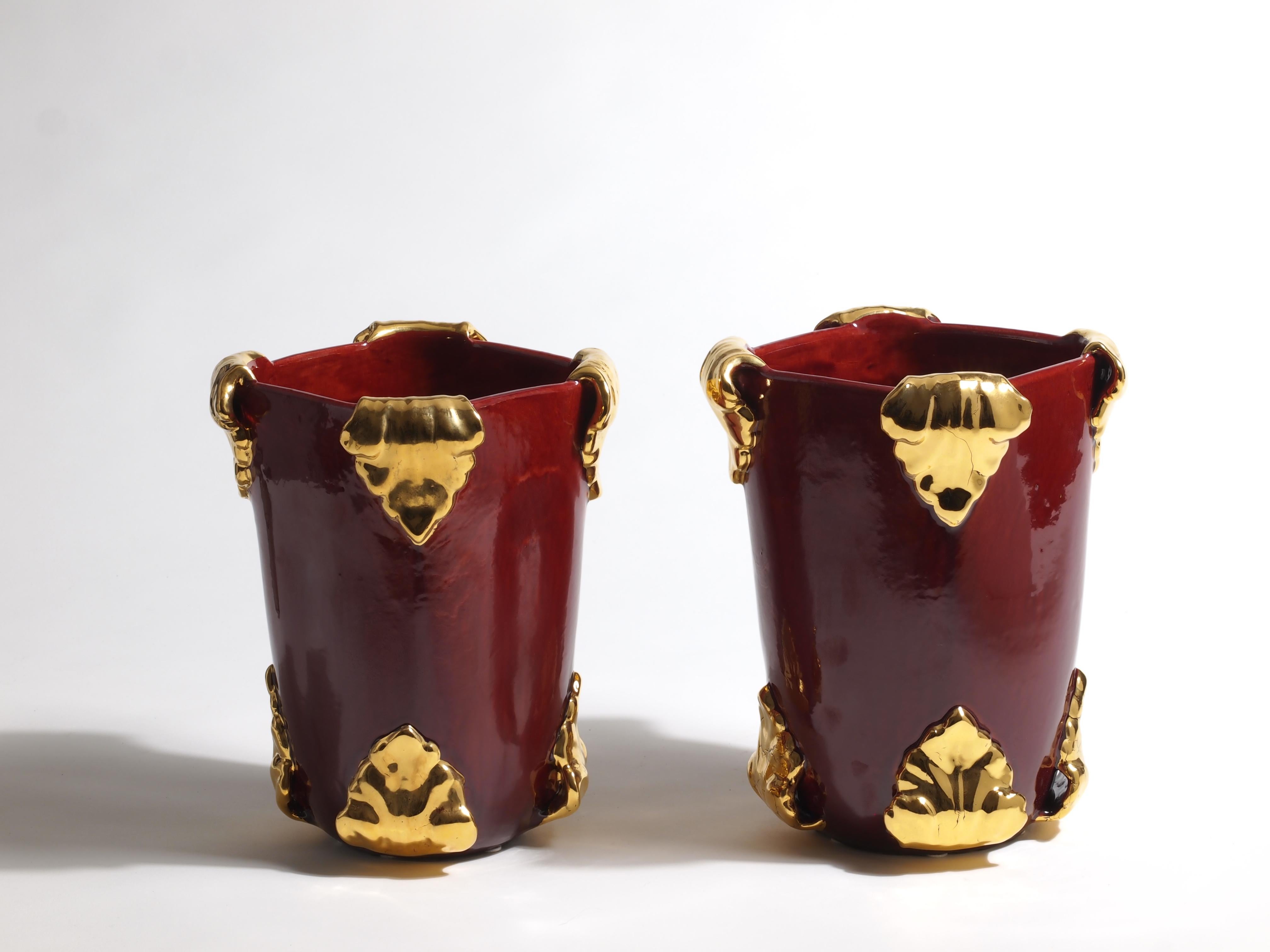 Pair of vases by Antonietta Mazzotti Emaldi, 2018, Glazed earthenware (majolica) and 24ct gold, entirely handmade, unique pieces. 

Antonietta Mazzotti (Faenza, Italy 1950) attended the Istituto d’Arte per la Ceramica in Faenza and opened her