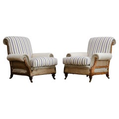 Pair of deep seated country house armchairs