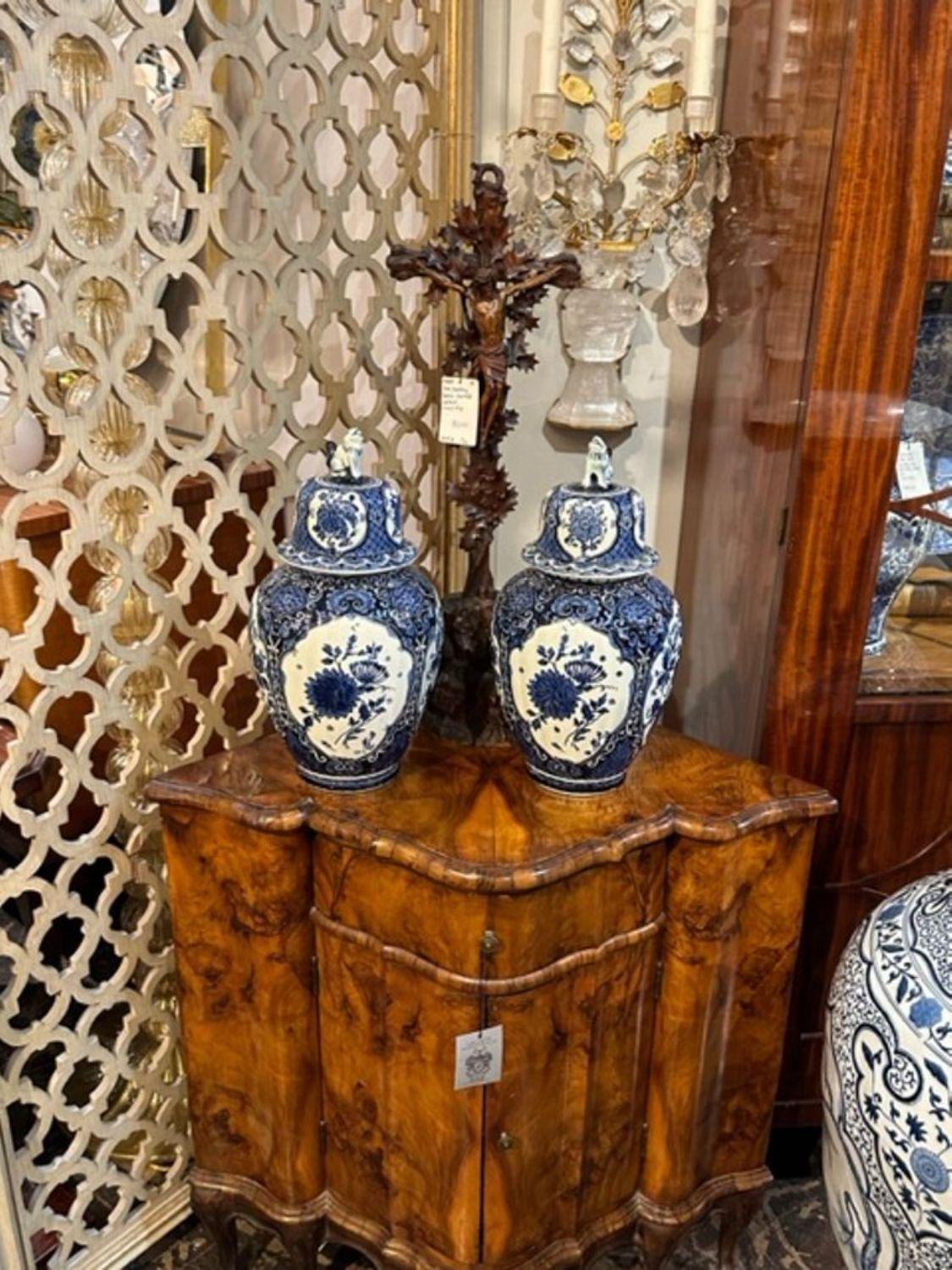 Pair of early 20th century Delft blue and white porcelain jars. circa 1920. A timeless and classic touch for a fine interior.