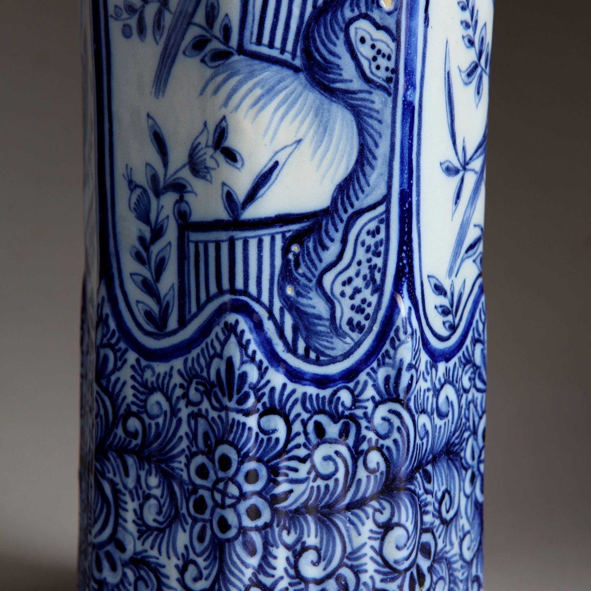 Charming pair of Delft style pottery vases as table lamps, decorated in cobalt blue over white, with fielded scenes of parakeets sitting in tree branches with insects and flowers within blue-painted scrolling borders.
Northern France, 19th