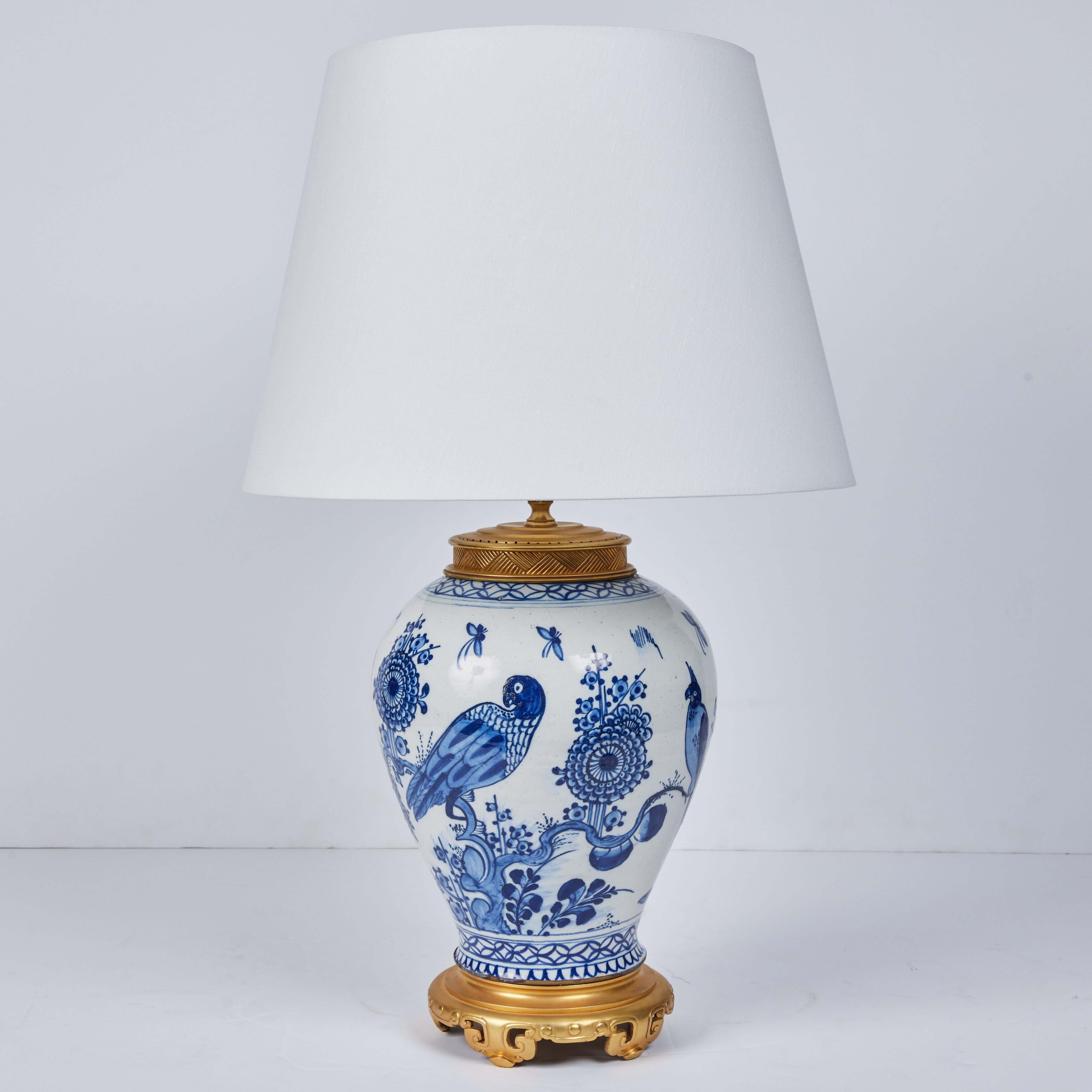 A beautiful pair of Delft glazed earthenware, hand painted jars with French gilded metal mounts.

 16