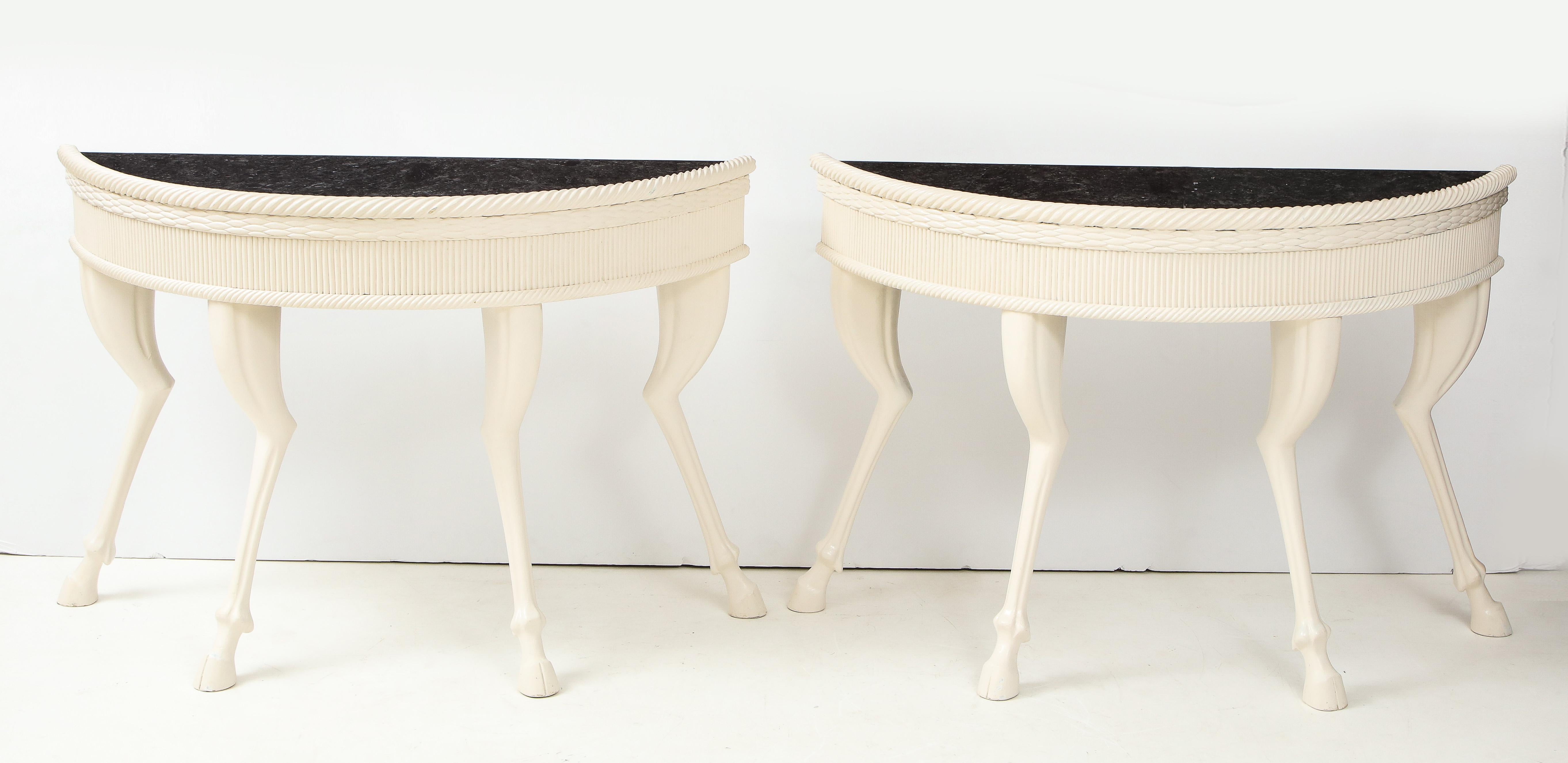 Wonderful pair of large demilune hoof foot console tables.
The wooden tables are supported by detailed legs and are in a white matte lacquered finish.
The marble tops slide into a recessed groove.
  