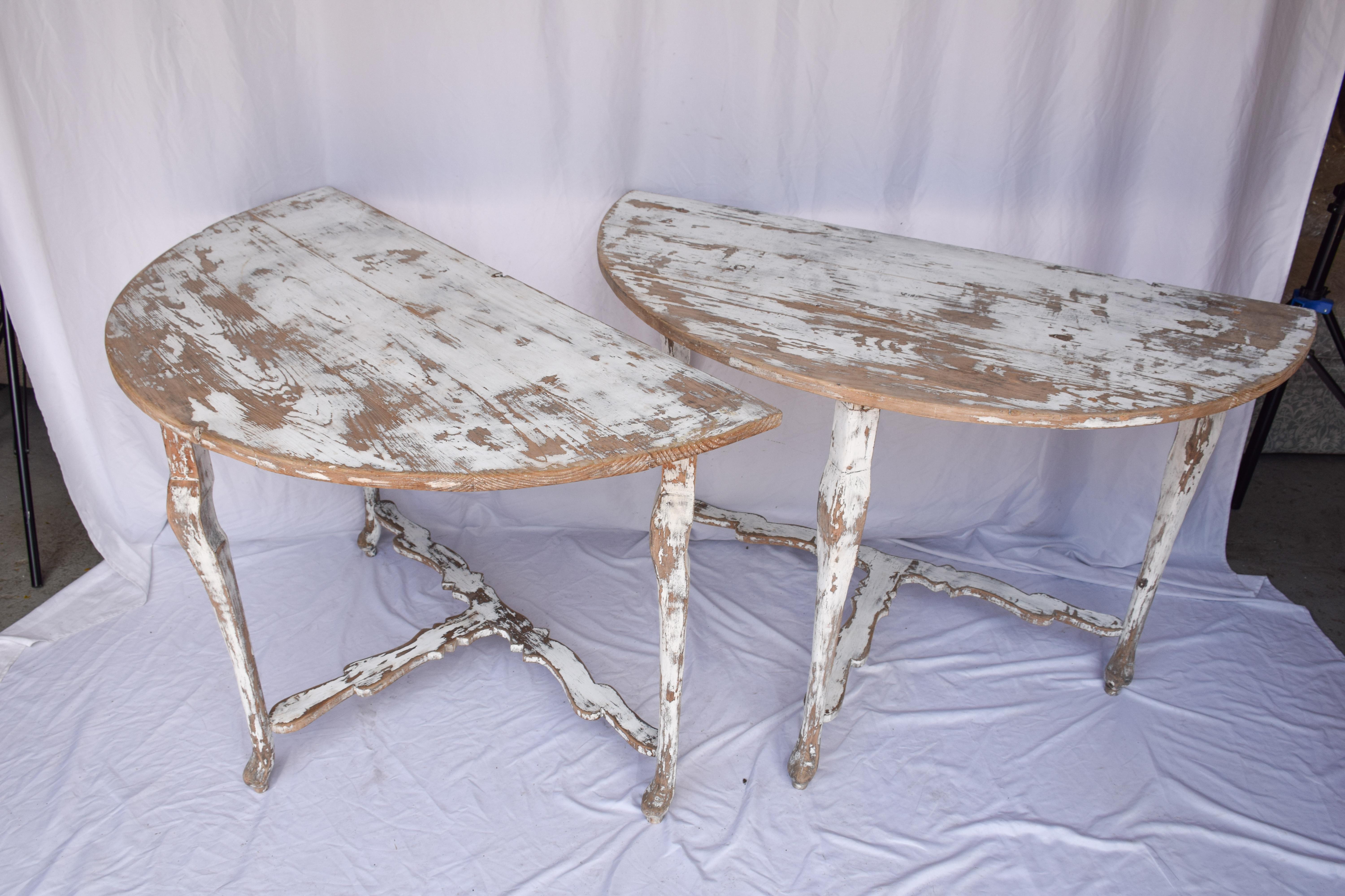Pair of Swedish Demi Lune Tables. Featuring a worn painted patina. The tables are sold as a pair. 

This pair of Swedish 19th century demi lune tables will bring some whimsy and cheer into a living room, bedroom, or sun room.

Individually - 23