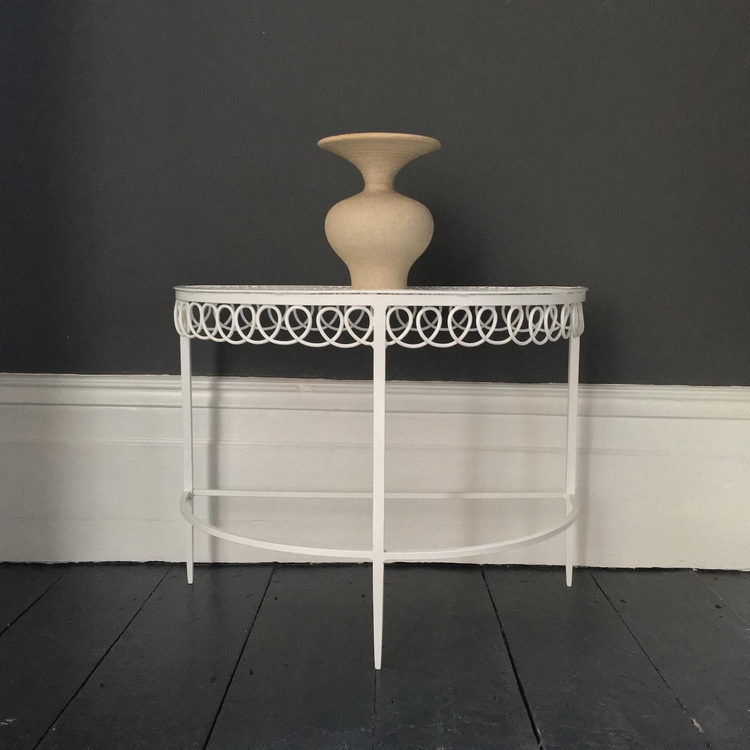 Pair of demilune side tables in white by Matégot, mid-20th century France. The tables can be used separately or pushed together to make a circle. 

Overall the tables are in nice condition and present well. There are some minor flaws visible from