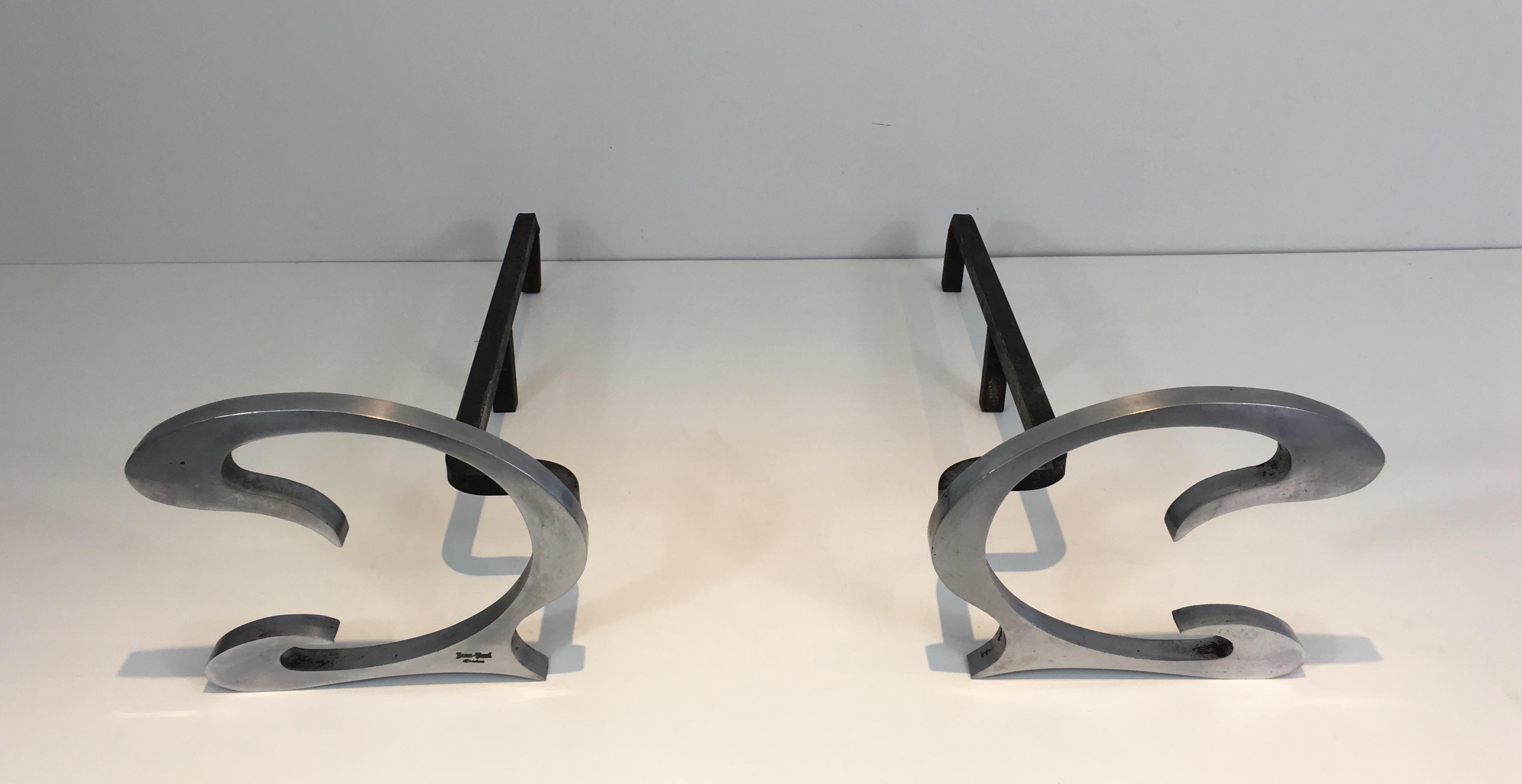 Jean-Paul Créations. This pair of design andirons are made of brushed steel and iron. They are French, signed by Jean-Paul Créations, circa 1970.