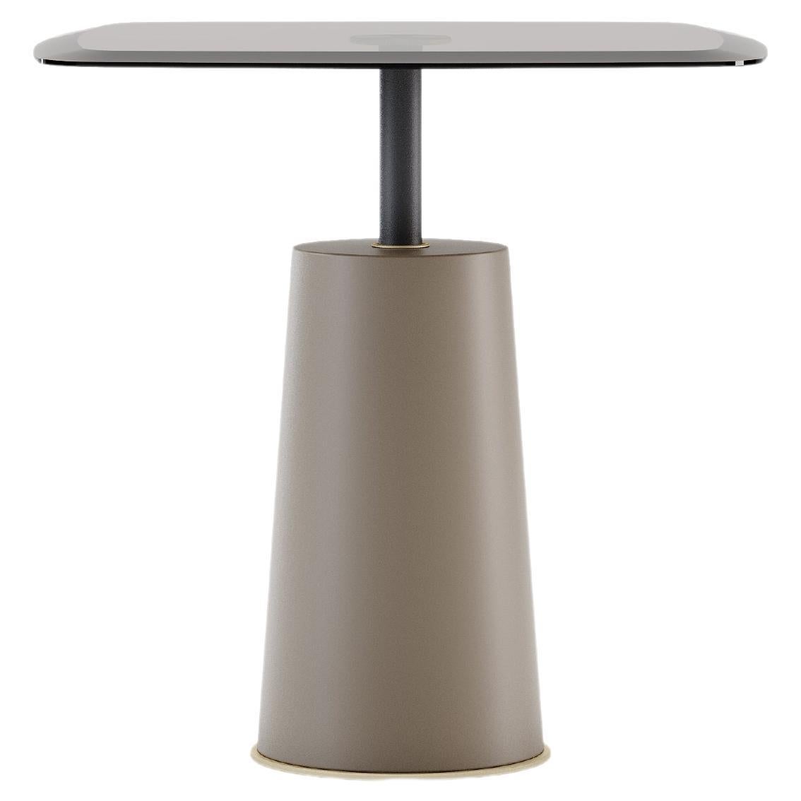 A superb table with a cozy style, generous shapes, and curvaceous design. The round glass top is welded to the conical wood base serving for various functions that can be included in both domestic settings and public venues. Along the piece, you