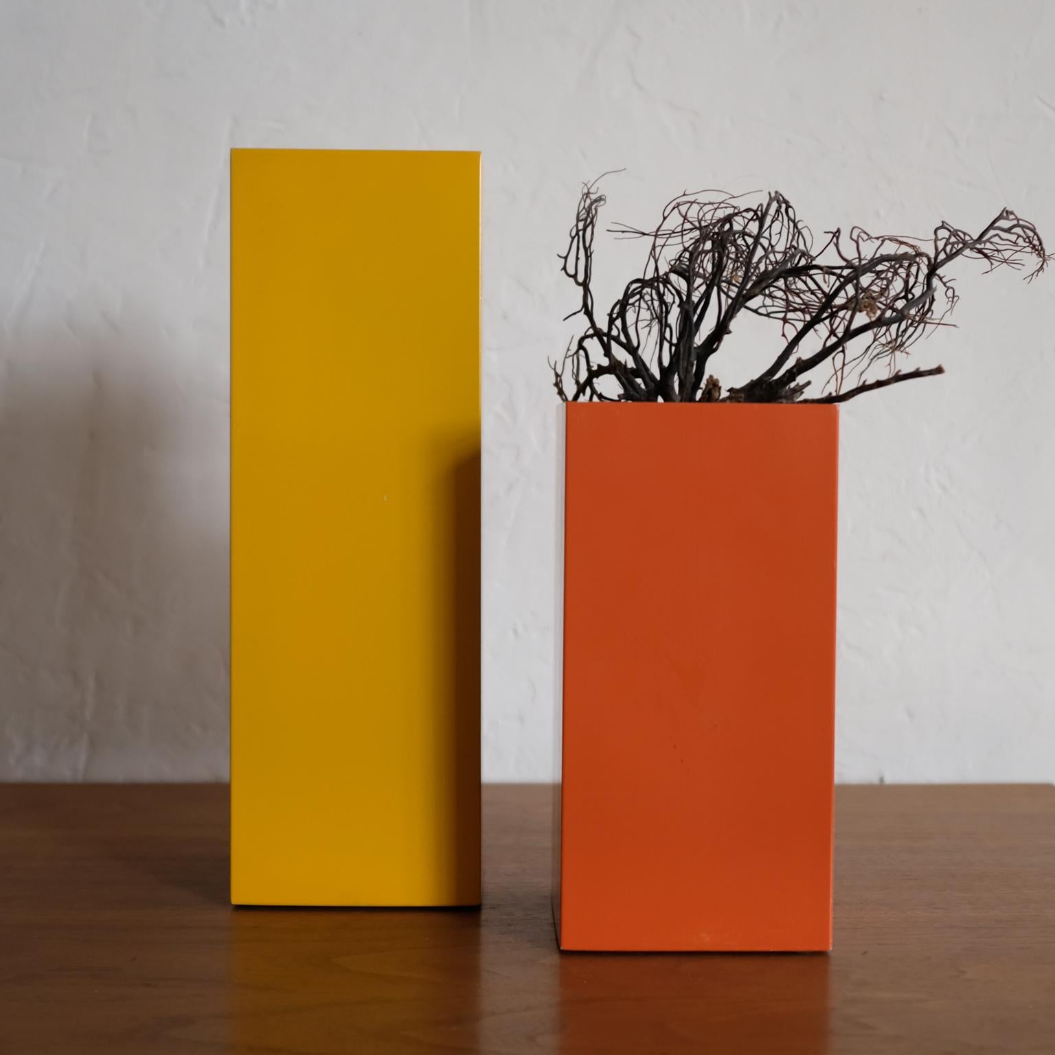 A pair of metal vases designed by Bill Curry for his Company, Design Line. Designed and manufactured in El Segundo, CA in the 1960s. 

The vases can be used on a table or can be hung on a wall. The vases are 4