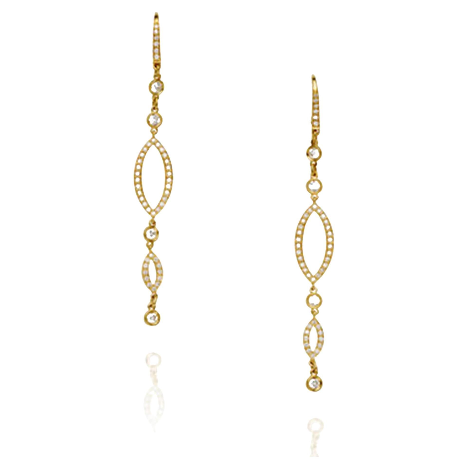 This is a beautiful pair of designer earrings set with 84 white diamonds in 18k yellow gold with an openwork dangle design.  The 8 larger diamonds measure .10 carats each with 88 additional diamonds total diamond weight of 2.0 carats.  The diamonds