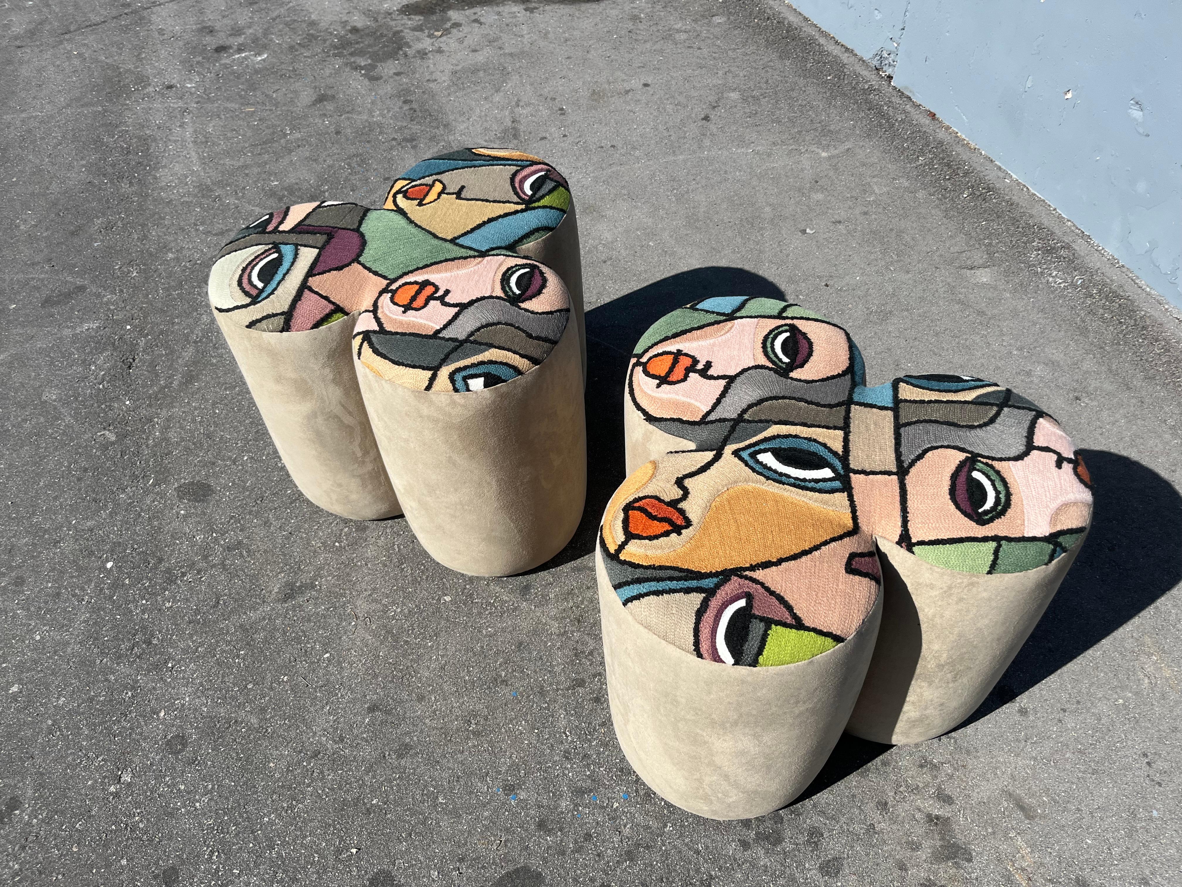 Pair of Designer Poufs, the top fabric is Italian Patchwork Art Fabric, the sides are suede style fabric. Price is for the pair, in total two pairs available. Excellent condition. Ready for a new home.