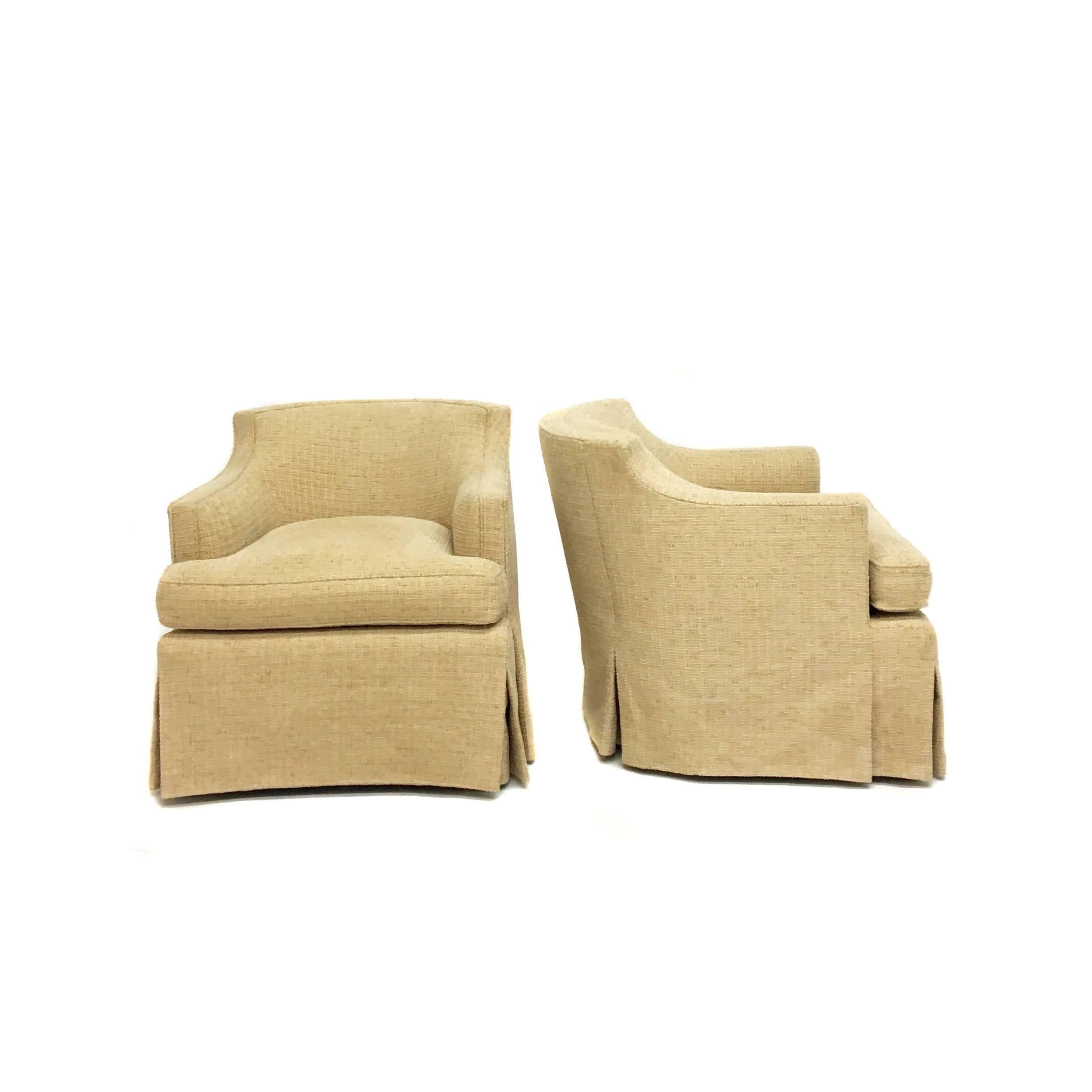 Woven chenille neutral swivel club chairs with pleated skirt and down foam seat. Profile of the chairs match, though the backs have slightly different pleating as seen in photo. Age appropriate wear. 

Measurements: 28