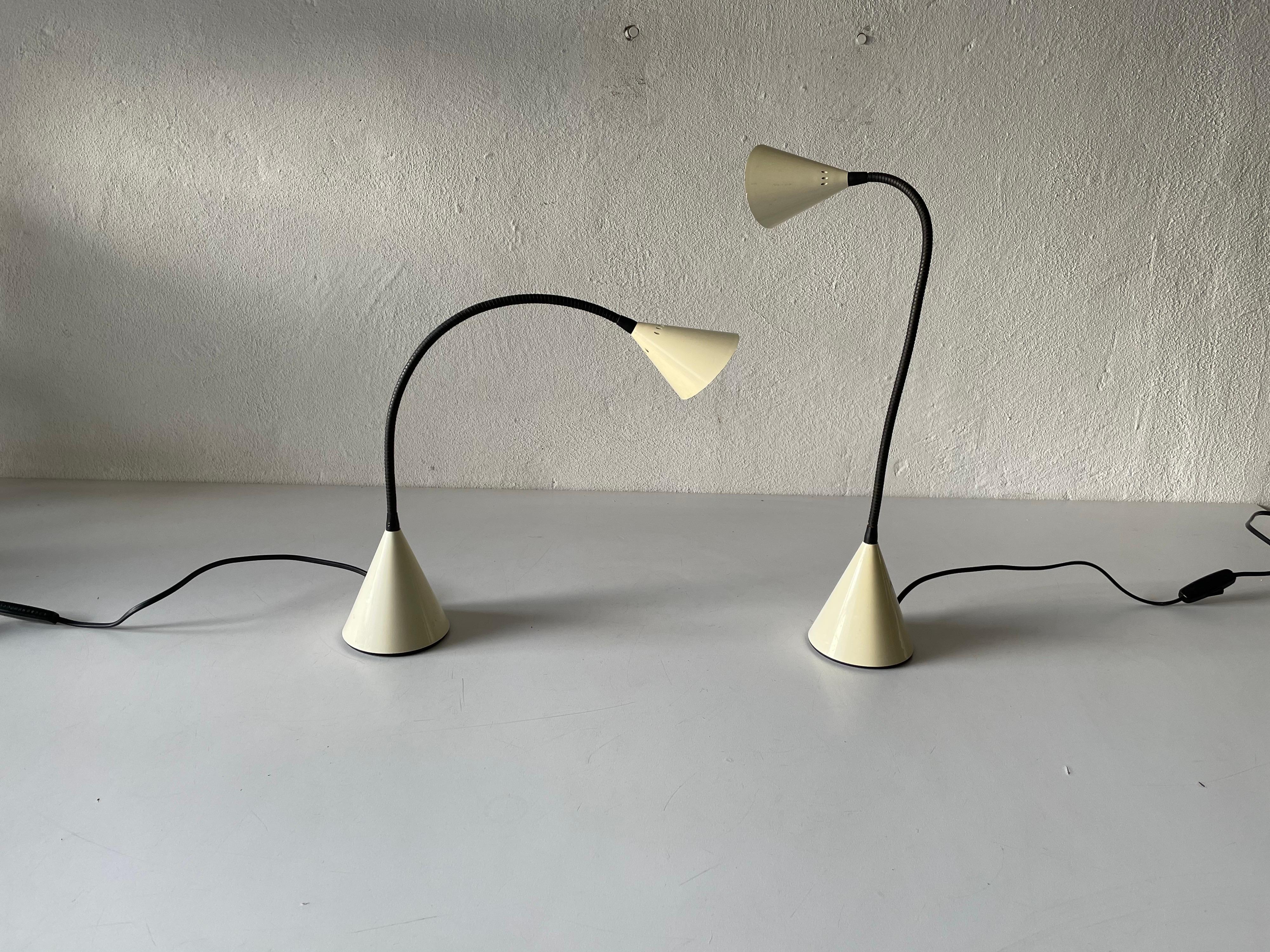 Pair of desk lamps by S. Renko for Egoluce, 1980s, Italy
Model Twist

Minimal design 
Very high quality.
Fully functional.
Adjustable body.

Original cable and plug. Switch on-off on the cable. 
This lamp is suitable for EU plug socket.