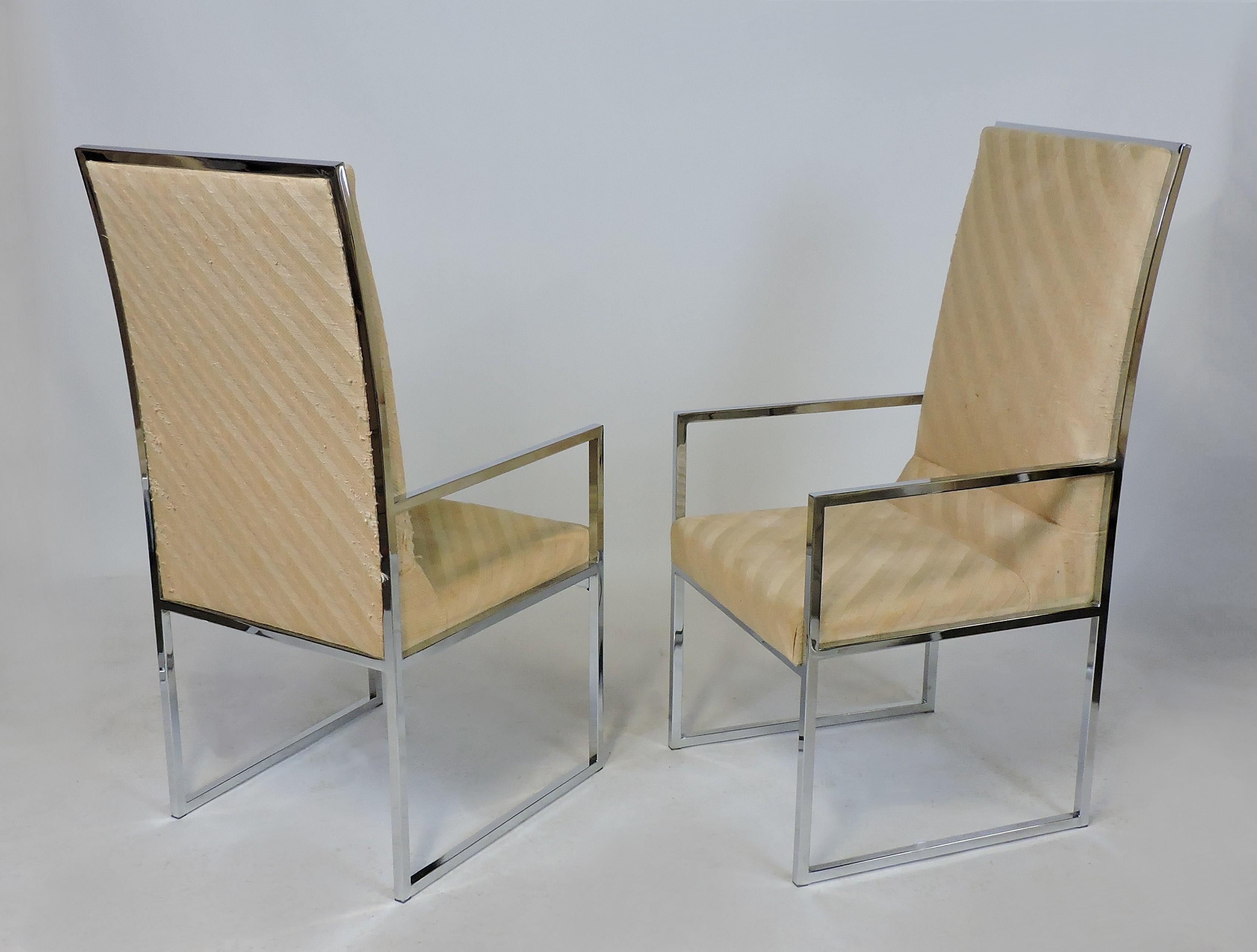Handsome pair of high back dining chairs manufactured by Design Institute of America. These heavy and high quality chairs have a clean, classic look with thin chrome frames and upholstered backs and seats. This pair had been part of a larger set of
