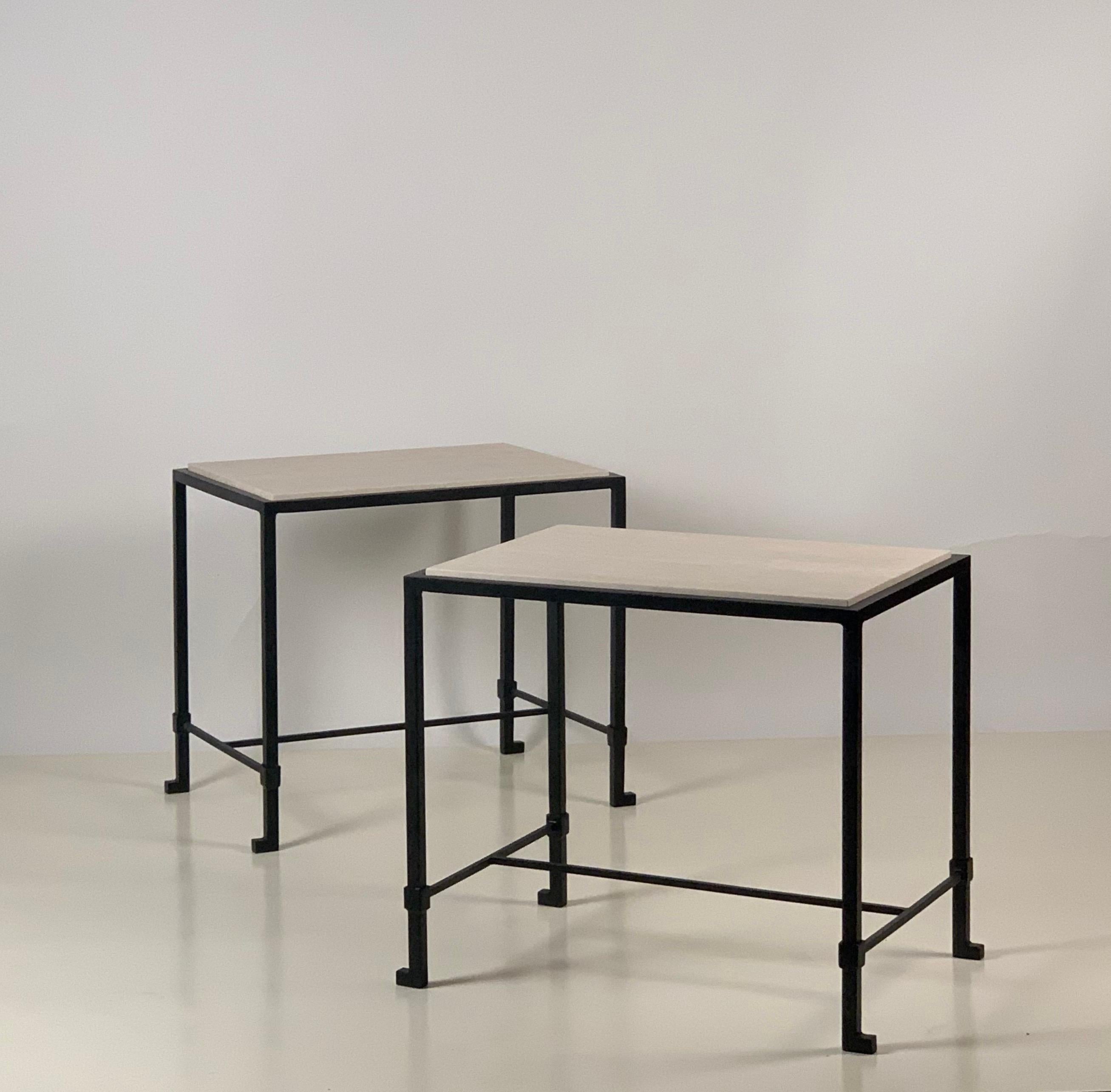 Introducing our 'Diagramme' Art Deco-inspired side tables, a harmonious blend of timeless elegance and modern sophistication.

These chic side tables are a harmonious blend of blackened iron and cream honed travertine, combining the rich allure of