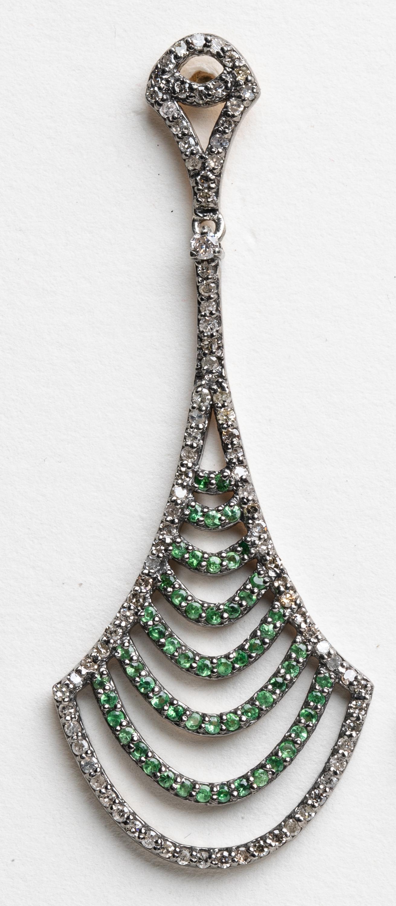 A pair of fan-shaped chandelier earrings with pave`-set tsavorite round-cut stones bordered by brilliant round diamonds also in a pave` setting.  Set in sterling silver with 18K gold posts for pierced ears.  Stones total 2.35 carats.