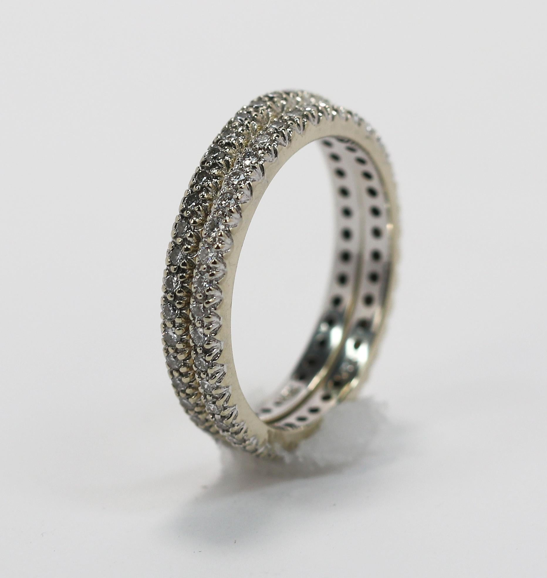 Perfect for stacking, this pair of white gold and diamond eternity bands has the perfect amount of sparkle on their own, or to compliment another ring. Crafted in 18K white gold, each band is set with approximately 0.50ct of round brilliant cut